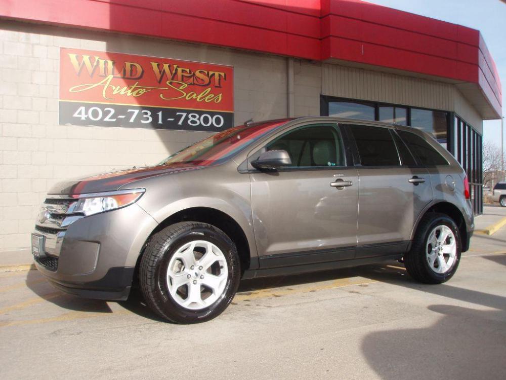 2013 TAN FORD EDGE SEL (2FMDK4JC7DB) with an 3.5L engine, Automatic transmission, located at 6610 L St., Omaha, NE, 68117, (402) 731-7800, 41.212872, -96.014702 - Photo #0