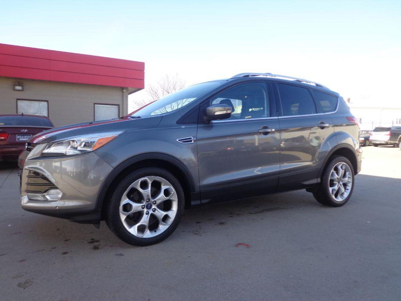 2013 GRAY FORD ESCAPE TITANIUM (1FMCU9J91DU) with an 2.0L engine, Automatic transmission, located at 6610 L St., Omaha, NE, 68117, (402) 731-7800, 41.212872, -96.014702 - 1-OWNER CLEAN CARFAX LOW MILEAGE LOADED WITH PANORAMIC ROOF, BLIND SPOT ASSIST, ACTIVE PARK ASSIST, NAV, BACKUP CAM AND MUCH MORE! *****We have found that most customers do the majority of their shopping online before visiting a dealership. For this reason we feel it necessary to have a compet - Photo #0