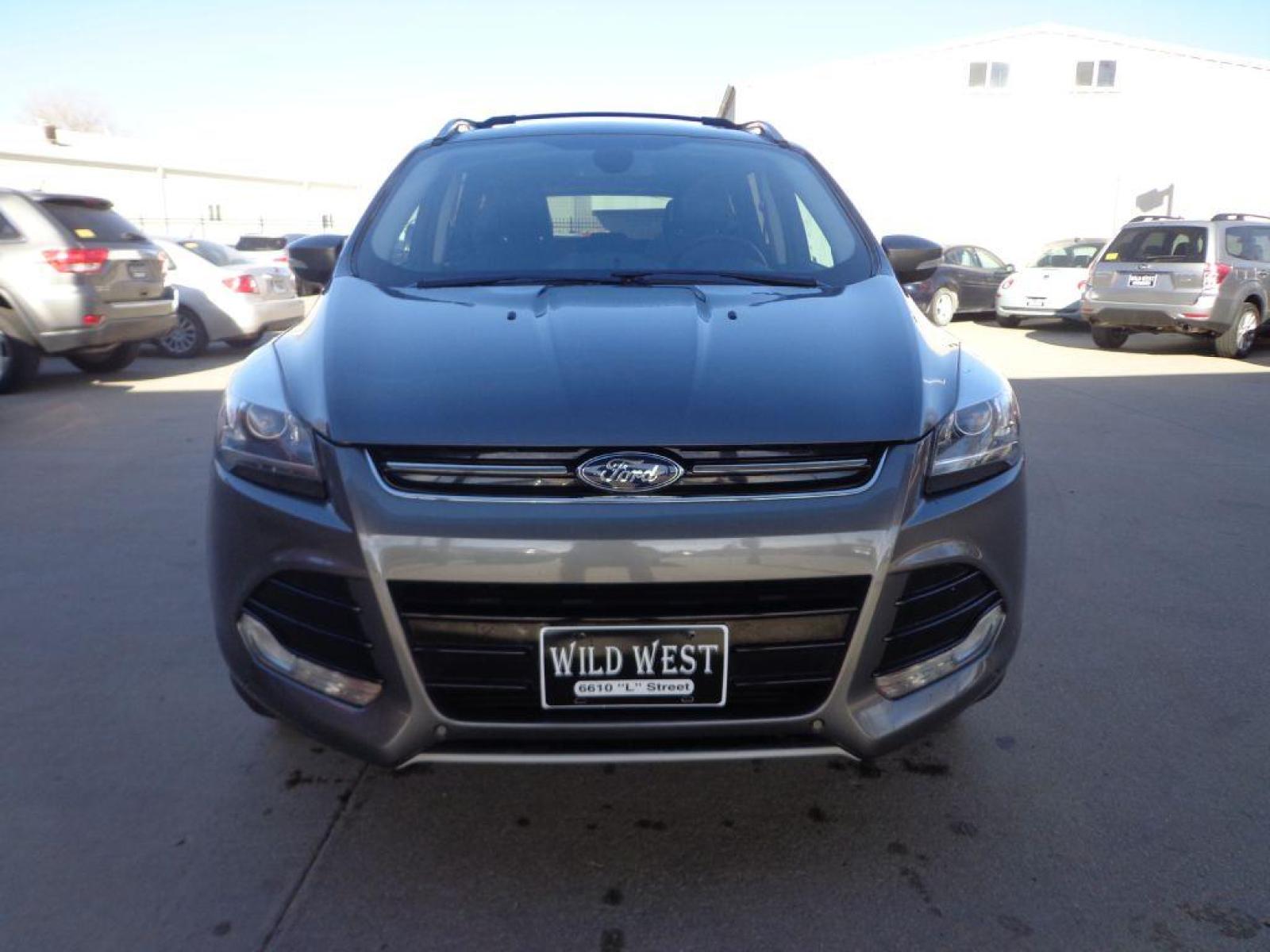 2013 GRAY FORD ESCAPE TITANIUM (1FMCU9J91DU) with an 2.0L engine, Automatic transmission, located at 6610 L St., Omaha, NE, 68117, (402) 731-7800, 41.212872, -96.014702 - 1-OWNER CLEAN CARFAX LOW MILEAGE LOADED WITH PANORAMIC ROOF, BLIND SPOT ASSIST, ACTIVE PARK ASSIST, NAV, BACKUP CAM AND MUCH MORE! *****We have found that most customers do the majority of their shopping online before visiting a dealership. For this reason we feel it necessary to have a compet - Photo #1