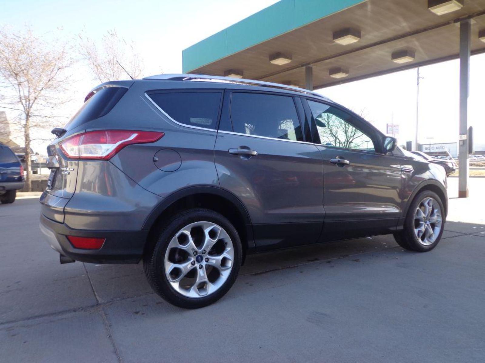 2013 GRAY FORD ESCAPE TITANIUM (1FMCU9J91DU) with an 2.0L engine, Automatic transmission, located at 6610 L St., Omaha, NE, 68117, (402) 731-7800, 41.212872, -96.014702 - 1-OWNER CLEAN CARFAX LOW MILEAGE LOADED WITH PANORAMIC ROOF, BLIND SPOT ASSIST, ACTIVE PARK ASSIST, NAV, BACKUP CAM AND MUCH MORE! *****We have found that most customers do the majority of their shopping online before visiting a dealership. For this reason we feel it necessary to have a compet - Photo #3