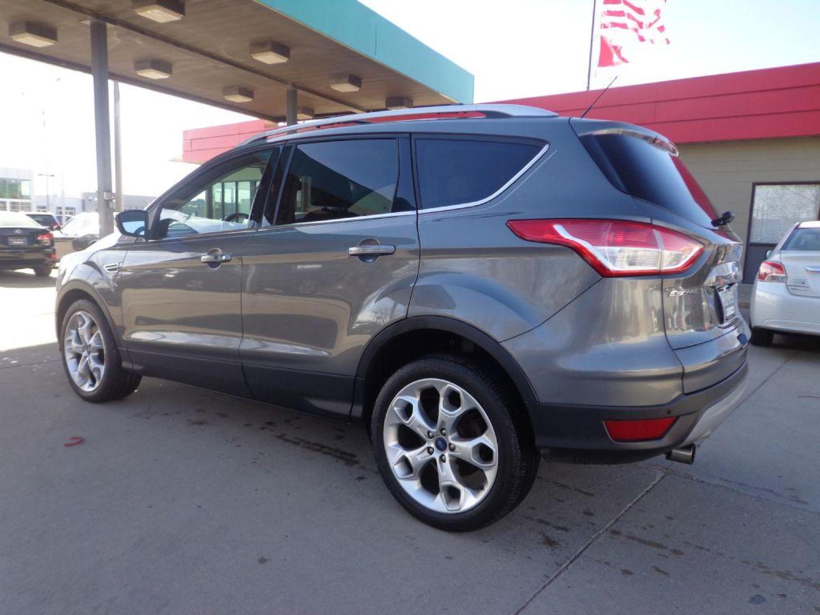 2013 GRAY FORD ESCAPE TITANIUM (1FMCU9J91DU) with an 2.0L engine, Automatic transmission, located at 6610 L St., Omaha, NE, 68117, (402) 731-7800, 41.212872, -96.014702 - 1-OWNER CLEAN CARFAX LOW MILEAGE LOADED WITH PANORAMIC ROOF, BLIND SPOT ASSIST, ACTIVE PARK ASSIST, NAV, BACKUP CAM AND MUCH MORE! *****We have found that most customers do the majority of their shopping online before visiting a dealership. For this reason we feel it necessary to have a compet - Photo #5