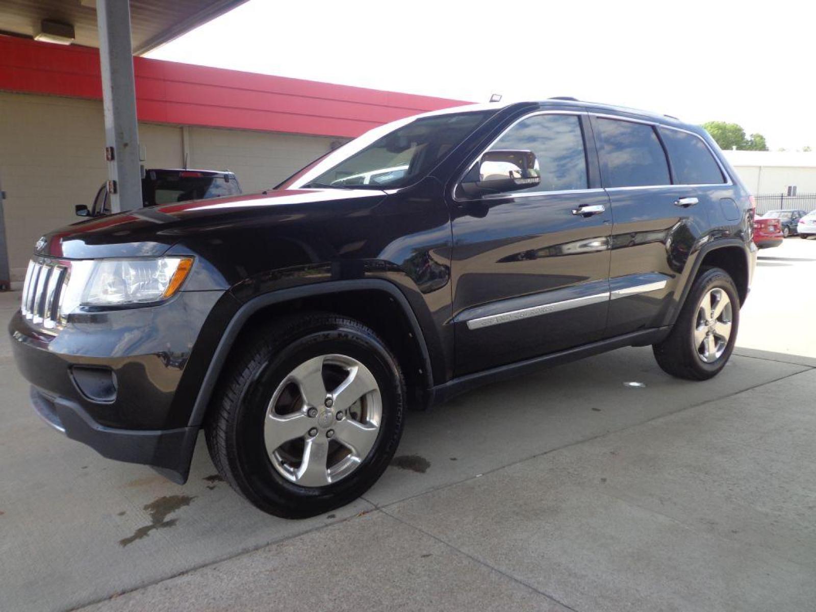 2013 BLACK JEEP GRAND CHEROKEE LIMITED (1C4RJFBT9DC) with an 5.7L engine, Automatic transmission, located at 6610 L St., Omaha, NE, 68117, (402) 731-7800, 41.212872, -96.014702 - 2-OWNER CLEAN CARFAX LOW MILEAGE LOADED WITH PANORAMIC ROOF, HEATED/COOLED SEATS, NAV, BACKUP CAM AND NEWER TIRES! *****We have found that most customers do the majority of their shopping online before visiting a dealership. For this reason we feel it necessary to have a competitive price on ou - Photo #0