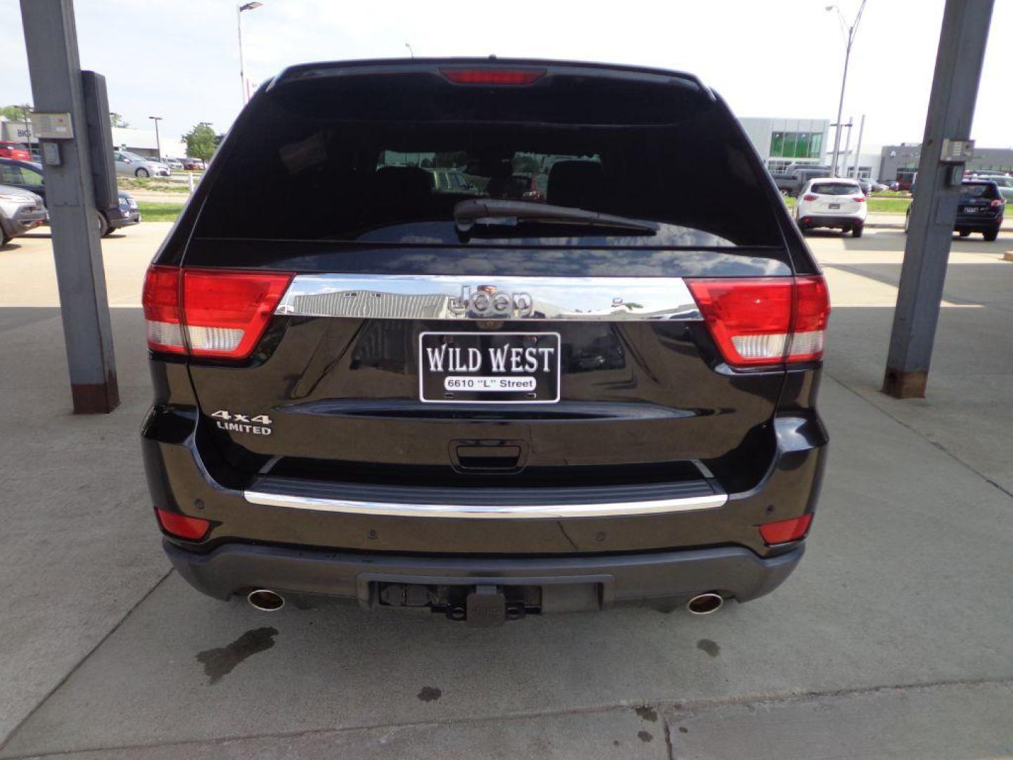 2013 BLACK JEEP GRAND CHEROKEE LIMITED (1C4RJFBT9DC) with an 5.7L engine, Automatic transmission, located at 6610 L St., Omaha, NE, 68117, (402) 731-7800, 41.212872, -96.014702 - 2-OWNER CLEAN CARFAX LOW MILEAGE LOADED WITH PANORAMIC ROOF, HEATED/COOLED SEATS, NAV, BACKUP CAM AND NEWER TIRES! *****We have found that most customers do the majority of their shopping online before visiting a dealership. For this reason we feel it necessary to have a competitive price on ou - Photo#4