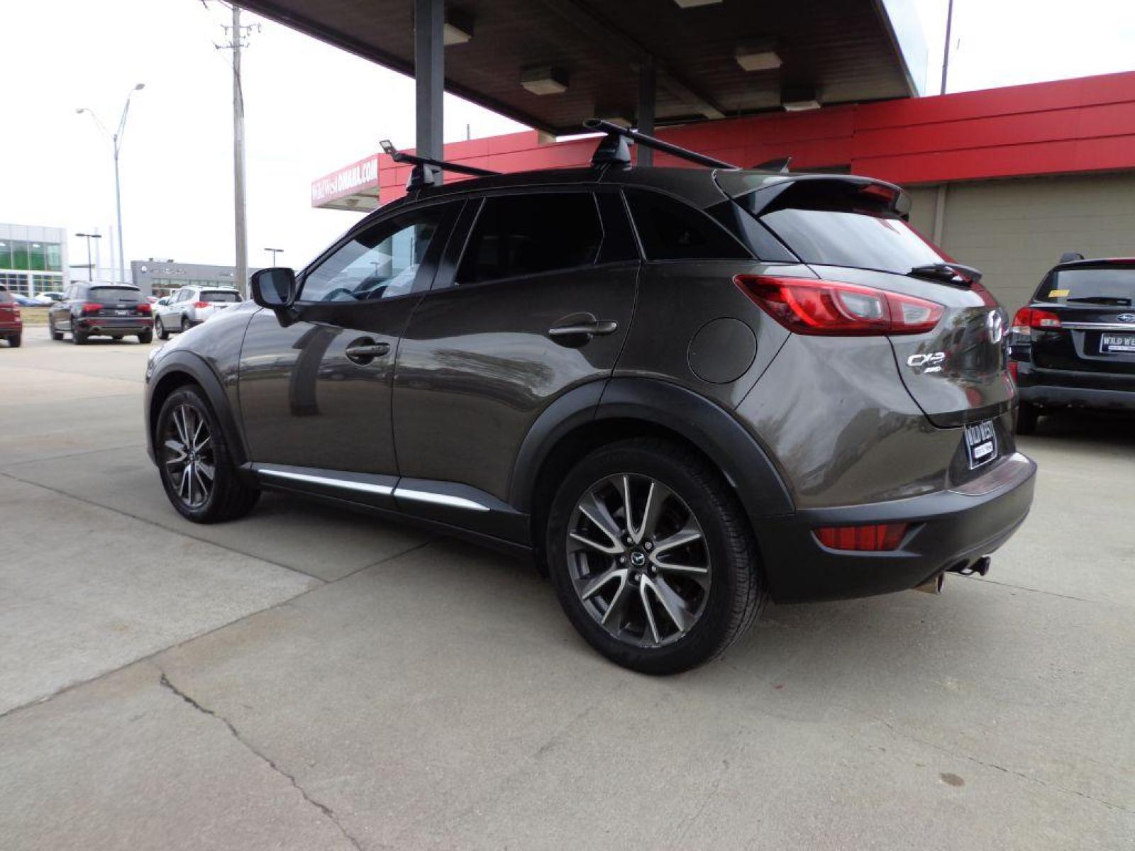 2016 GRAY MAZDA CX-3 GRAND TOURING (JM1DKBD79G0) with an 2.0L engine, Automatic transmission, located at 6610 L St., Omaha, NE, 68117, (402) 731-7800, 41.212872, -96.014702 - SHARP GRAND TOURING MODEL WITH LOW MILEAGE, A CLEAN CARFAX, HEATED LEATHER, SUNROOF, NAV, BACKUP CAM, BOSE AUDIO, NEWER TIRES AND MUCH MORE! *****We have found that most customers do the majority of their shopping online before visiting a dealership. For this reason we feel it necessary to have - Photo #5