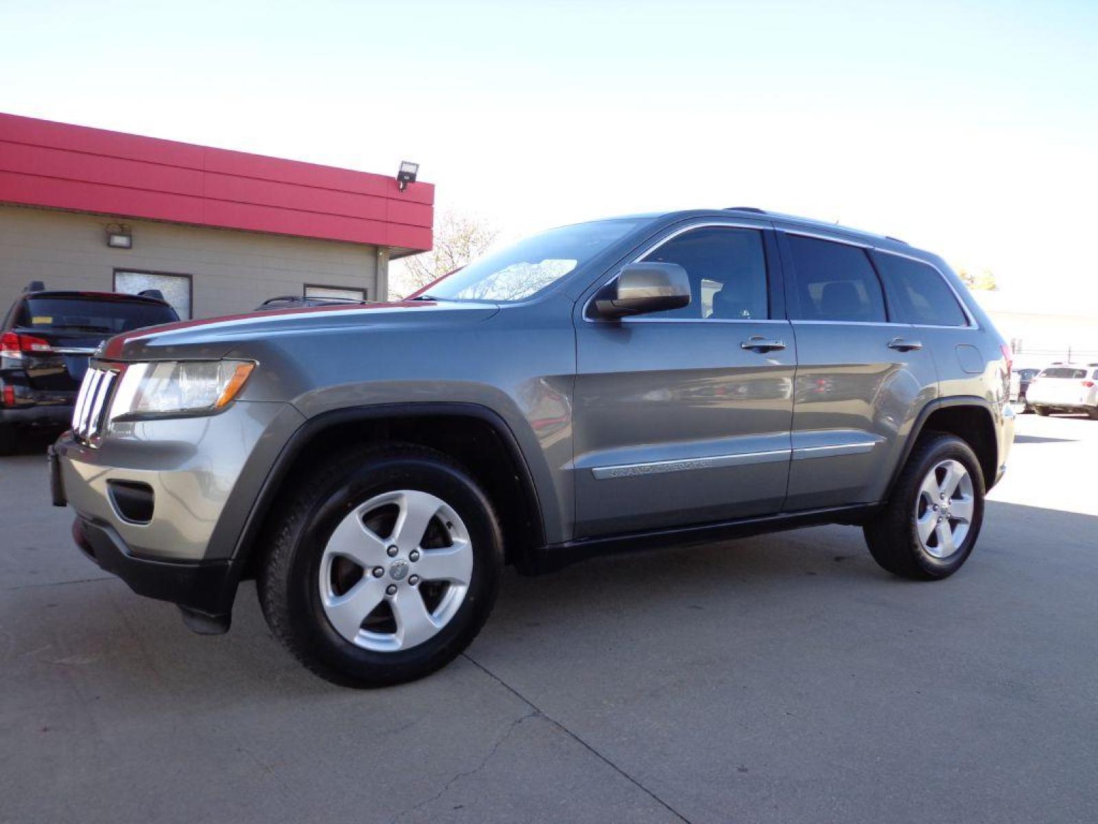 2012 GRAY JEEP GRAND CHEROKEE LAREDO (1C4RJFAG7CC) with an 3.6L engine, Automatic transmission, located at 6610 L St., Omaha, NE, 68117, (402) 731-7800, 41.212872, -96.014702 - 2-OWNER CLEAN CARFAX LOW MILEAGE LOADED WITH HEATED LEATHER, SUNROOF, NAV AND BACKUP CAM! *****We have found that most customers do the majority of their shopping online before visiting a dealership. For this reason we feel it necessary to have a competitive price on our used vehicles right up - Photo #0