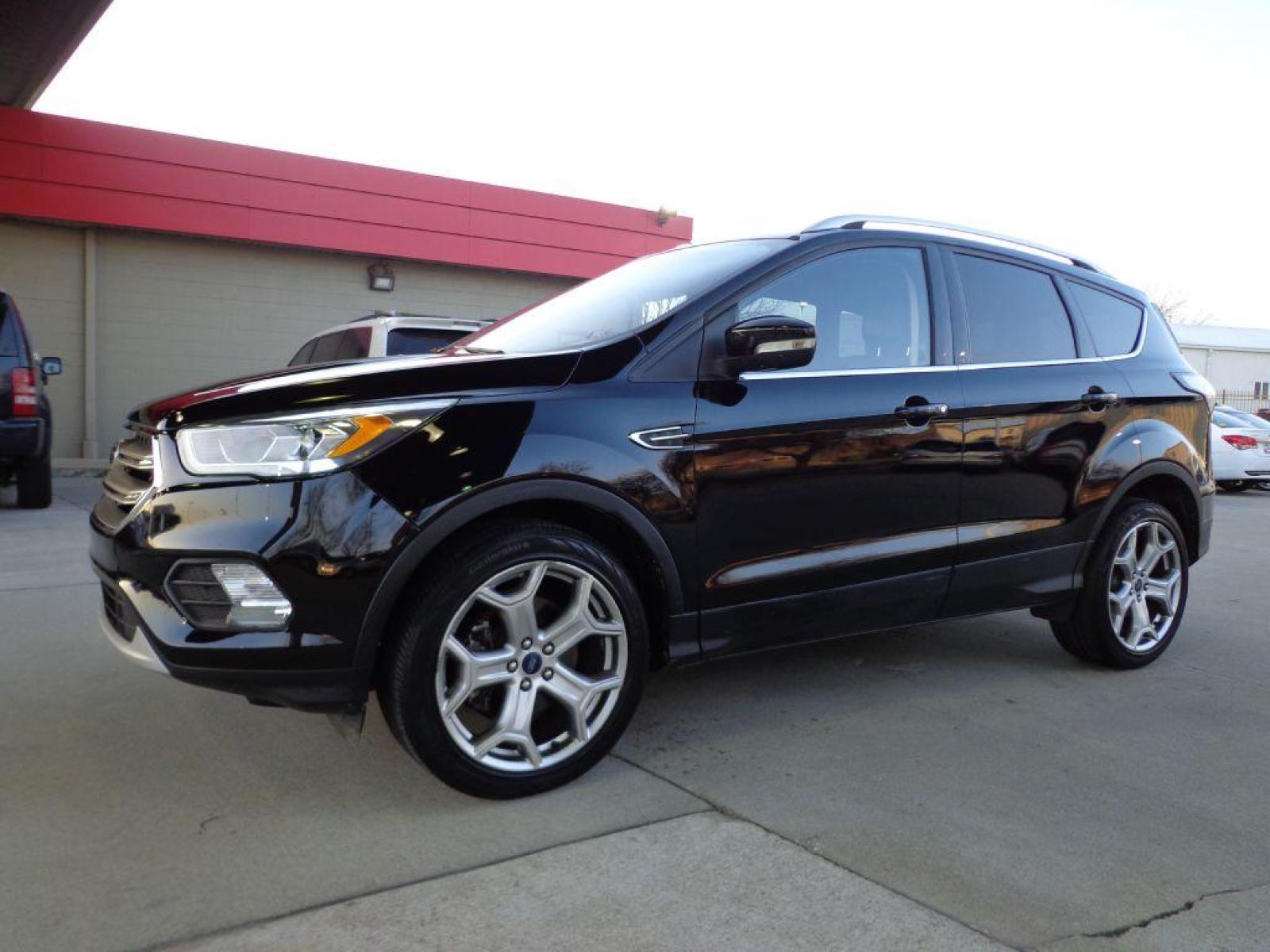2017 BLACK FORD ESCAPE TITANIUM (1FMCU9J99HU) with an 2.0L engine, Automatic transmission, located at 6610 L St., Omaha, NE, 68117, (402) 731-7800, 41.212872, -96.014702 - SHARP 1-OWNER CLEAN CARFAX LOW MILEAGE LOADED WITH NAV, PANORAMIC ROOF, NEWER TIRES AND MUCH MORE! *****We have found that most customers do the majority of their shopping online before visiting a dealership. For this reason we feel it necessary to have a competitive price on our used vehicles - Photo #0