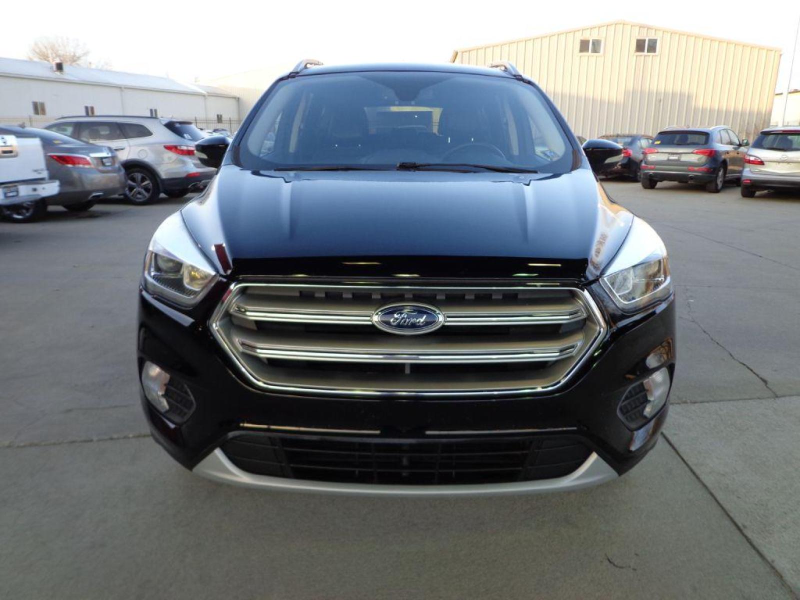 2017 BLACK FORD ESCAPE TITANIUM (1FMCU9J99HU) with an 2.0L engine, Automatic transmission, located at 6610 L St., Omaha, NE, 68117, (402) 731-7800, 41.212872, -96.014702 - SHARP 1-OWNER CLEAN CARFAX LOW MILEAGE LOADED WITH NAV, PANORAMIC ROOF, NEWER TIRES AND MUCH MORE! *****We have found that most customers do the majority of their shopping online before visiting a dealership. For this reason we feel it necessary to have a competitive price on our used vehicles - Photo #1
