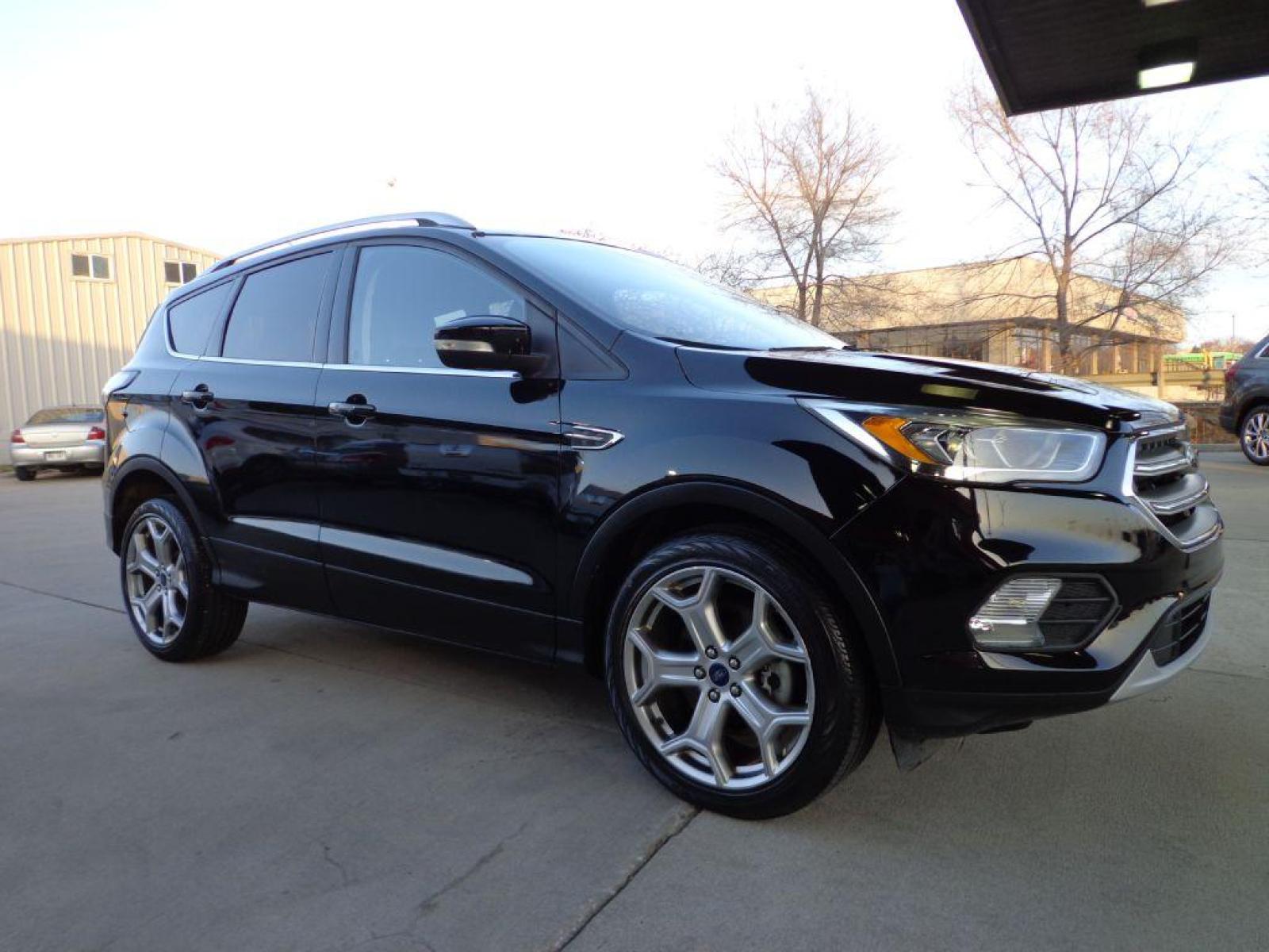 2017 BLACK FORD ESCAPE TITANIUM (1FMCU9J99HU) with an 2.0L engine, Automatic transmission, located at 6610 L St., Omaha, NE, 68117, (402) 731-7800, 41.212872, -96.014702 - SHARP 1-OWNER CLEAN CARFAX LOW MILEAGE LOADED WITH NAV, PANORAMIC ROOF, NEWER TIRES AND MUCH MORE! *****We have found that most customers do the majority of their shopping online before visiting a dealership. For this reason we feel it necessary to have a competitive price on our used vehicles - Photo #2