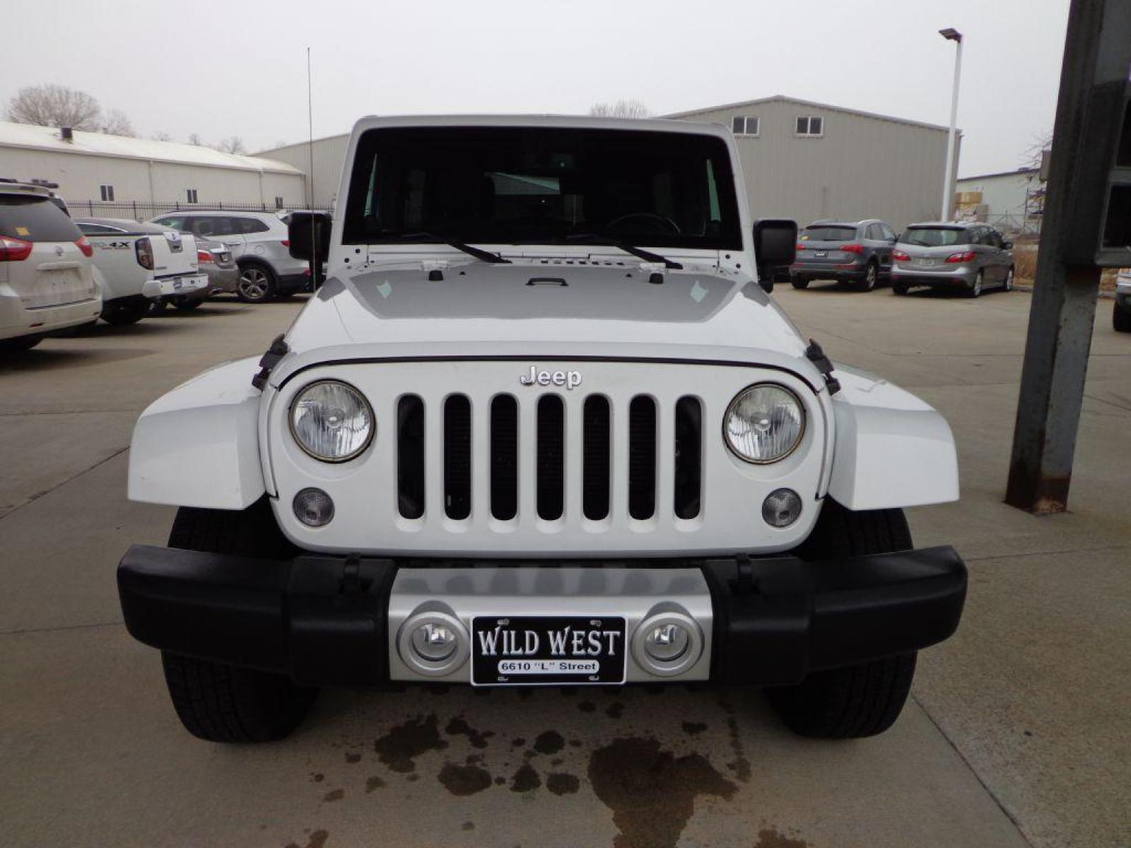 2014 WHITE JEEP WRANGLER UNLIMI SAHARA (1C4HJWEG6EL) with an 3.6L engine, Automatic transmission, located at 6610 L St., Omaha, NE, 68117, (402) 731-7800, 41.212872, -96.014702 - 2-OWNER CLEAN CARFAX LOW MILEAGE WITH HEATED LEATHER, NAV AND NEWER TIRES! *****We have found that most customers do the majority of their shopping online before visiting a dealership. For this reason we feel it necessary to have a competitive price on our used vehicles right up front. We spend - Photo #1