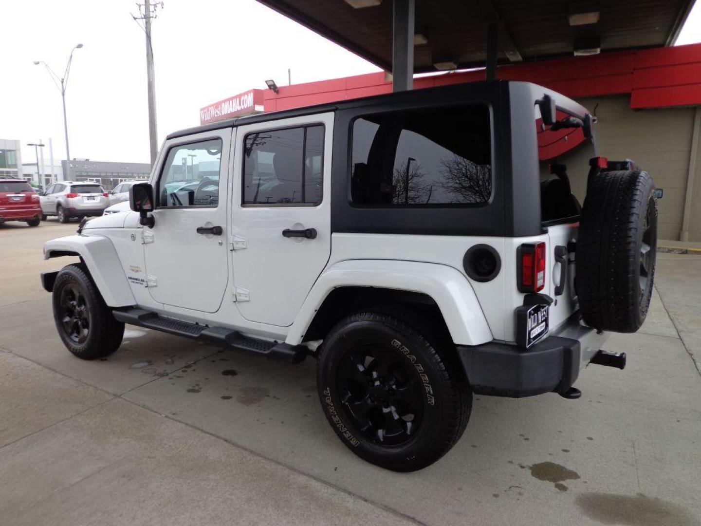2014 WHITE JEEP WRANGLER UNLIMI SAHARA (1C4HJWEG6EL) with an 3.6L engine, Automatic transmission, located at 6610 L St., Omaha, NE, 68117, (402) 731-7800, 41.212872, -96.014702 - 2-OWNER CLEAN CARFAX LOW MILEAGE WITH HEATED LEATHER, NAV AND NEWER TIRES! *****We have found that most customers do the majority of their shopping online before visiting a dealership. For this reason we feel it necessary to have a competitive price on our used vehicles right up front. We spend - Photo#5