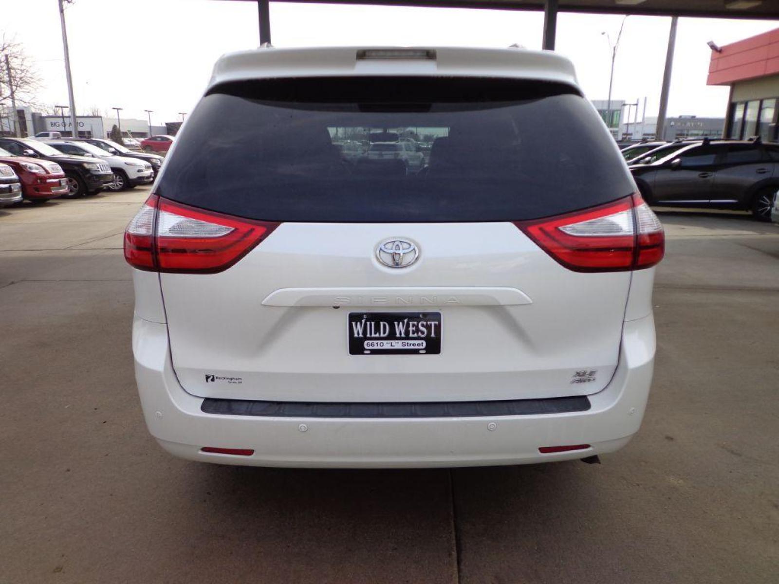 2015 WHITE TOYOTA SIENNA XLE (5TDDK3DC2FS) with an 3.5L engine, Automatic transmission, located at 6610 L St., Omaha, NE, 68117, (402) 731-7800, 41.212872, -96.014702 - 1-OWNER CLEAN CARFAX LOW MILEAGE AWD WITH A SUNROOF, NAV, REAR BUCKETS, BLIND SPOT ASSIST AND NEWER TIRES! *****We have found that most customers do the majority of their shopping online before visiting a dealership. For this reason we feel it necessary to have a competitive price on our used v - Photo #4