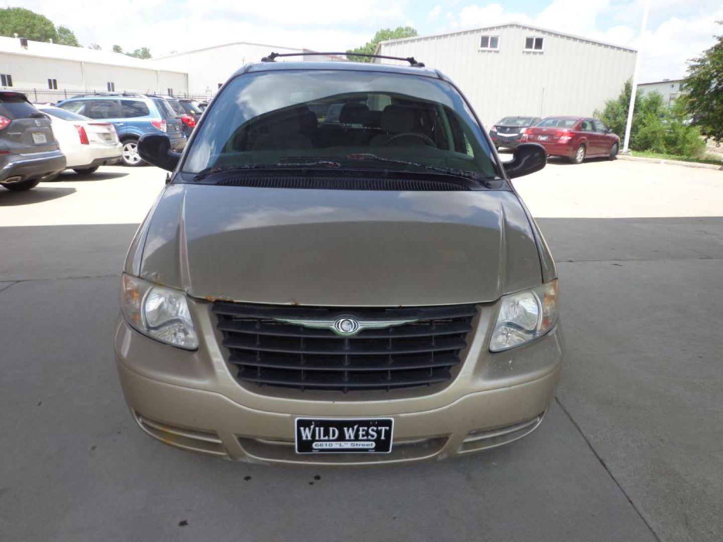 2006 TAN CHRYSLER TOWN and COUNTRY (1A4GP45R36B) with an 3.3L engine, Automatic transmission, located at 6610 L St., Omaha, NE, 68117, (402) 731-7800, 41.212872, -96.014702 - THIS VAN RUNS AND DRIVES GOOD WITH LOW MILEAGE AND COLD A/C. EXTERIOR IS RUSTY AND INTERIOR IS IN VERY GOOD CONDITION. *****We have found that most customers do the majority of their shopping online before visiting a dealership. For this reason we feel it necessary to have a competitive pric - Photo#1