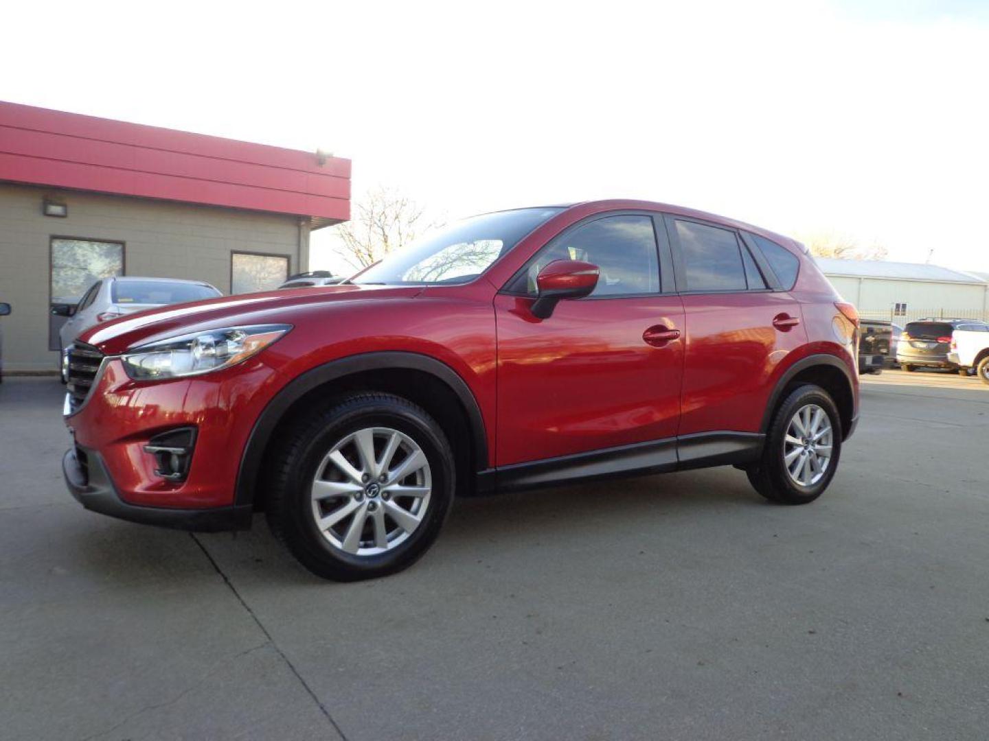 2016 RED MAZDA CX-5 TOURING (JM3KE4CY2G0) with an 2.5L engine, Automatic transmission, located at 6610 L St., Omaha, NE, 68117, (402) 731-7800, 41.212872, -96.014702 - Photo#0