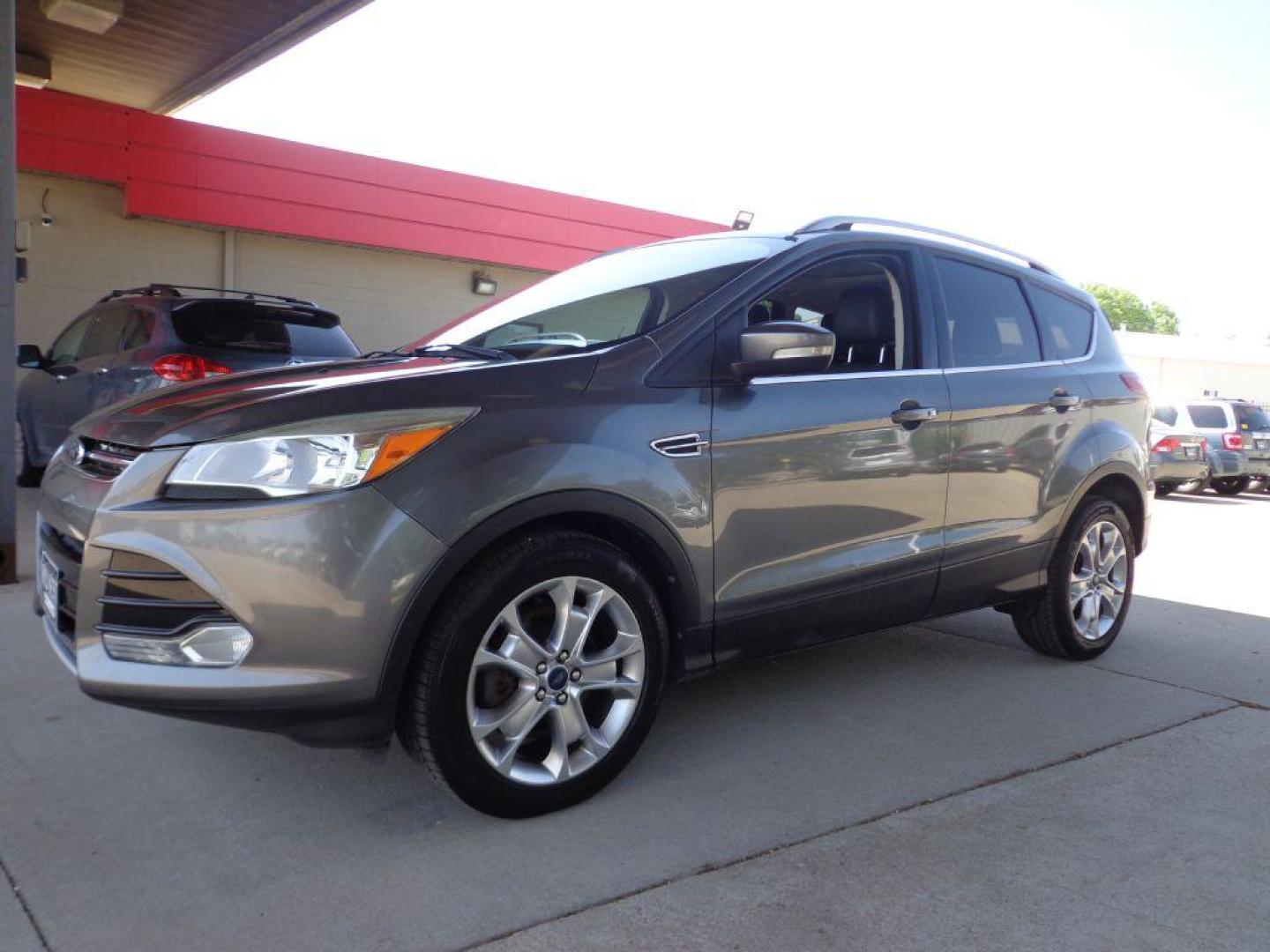 2014 GRAY FORD ESCAPE TITANIUM (1FMCU9J95EU) with an 2.0L engine, Automatic transmission, located at 6610 L St., Omaha, NE, 68117, (402) 731-7800, 41.212872, -96.014702 - 2-OWNER, CLEAN CAREFAX, LOW MILES, PANORAMIC ROOF, NAV, BACKUP CAM, REMOTE START AND NEWER TIRES! *****We have found that most customers do the majority of their shopping online before visiting a dealership. For this reason we feel it necessary to have a competitive price on our used vehicles - Photo#0