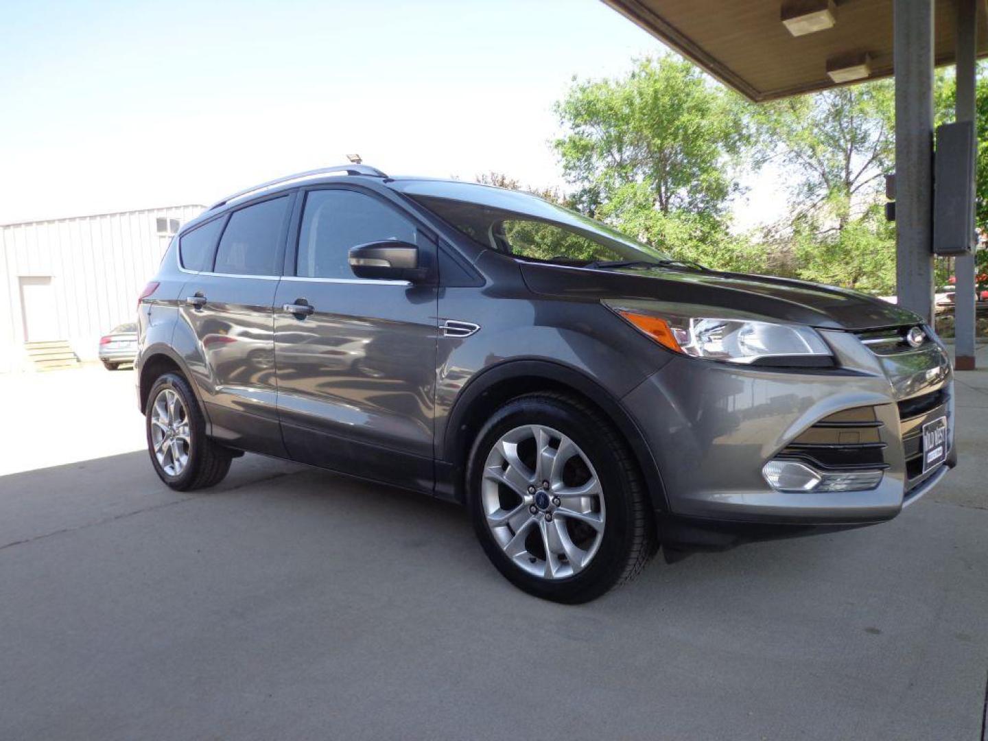 2014 GRAY FORD ESCAPE TITANIUM (1FMCU9J95EU) with an 2.0L engine, Automatic transmission, located at 6610 L St., Omaha, NE, 68117, (402) 731-7800, 41.212872, -96.014702 - 2-OWNER, CLEAN CAREFAX, LOW MILES, PANORAMIC ROOF, NAV, BACKUP CAM, REMOTE START AND NEWER TIRES! *****We have found that most customers do the majority of their shopping online before visiting a dealership. For this reason we feel it necessary to have a competitive price on our used vehicles - Photo#2