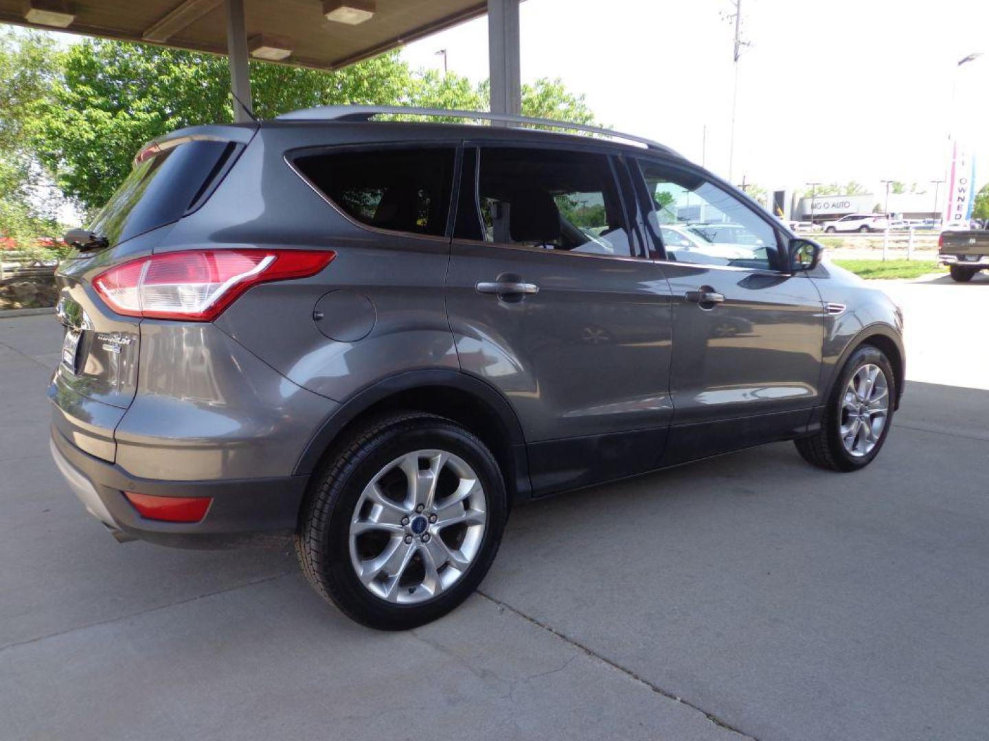 2014 GRAY FORD ESCAPE TITANIUM (1FMCU9J95EU) with an 2.0L engine, Automatic transmission, located at 6610 L St., Omaha, NE, 68117, (402) 731-7800, 41.212872, -96.014702 - 2-OWNER, CLEAN CAREFAX, LOW MILES, PANORAMIC ROOF, NAV, BACKUP CAM, REMOTE START AND NEWER TIRES! *****We have found that most customers do the majority of their shopping online before visiting a dealership. For this reason we feel it necessary to have a competitive price on our used vehicles - Photo#3
