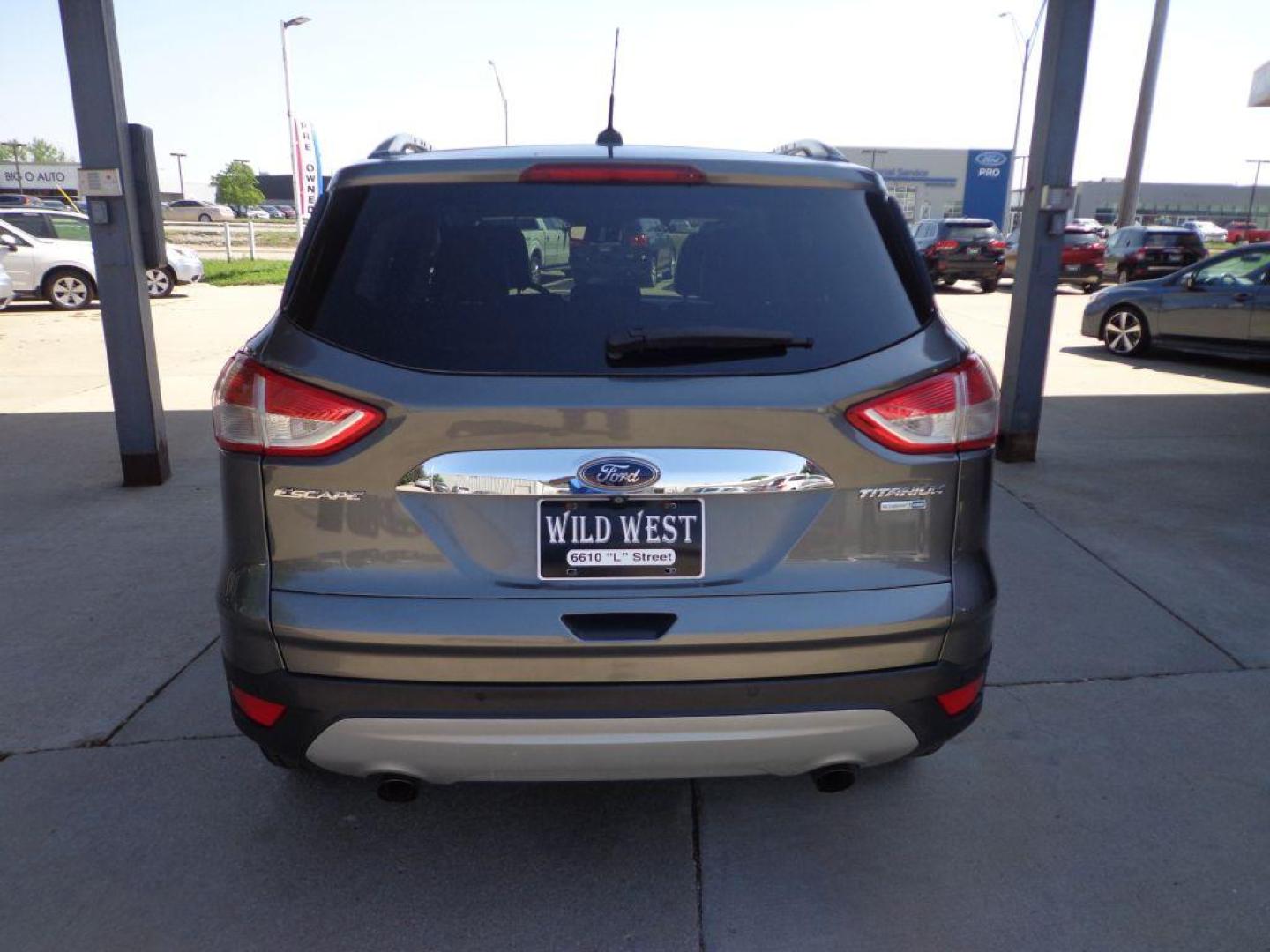 2014 GRAY FORD ESCAPE TITANIUM (1FMCU9J95EU) with an 2.0L engine, Automatic transmission, located at 6610 L St., Omaha, NE, 68117, (402) 731-7800, 41.212872, -96.014702 - 2-OWNER, CLEAN CAREFAX, LOW MILES, PANORAMIC ROOF, NAV, BACKUP CAM, REMOTE START AND NEWER TIRES! *****We have found that most customers do the majority of their shopping online before visiting a dealership. For this reason we feel it necessary to have a competitive price on our used vehicles - Photo#4