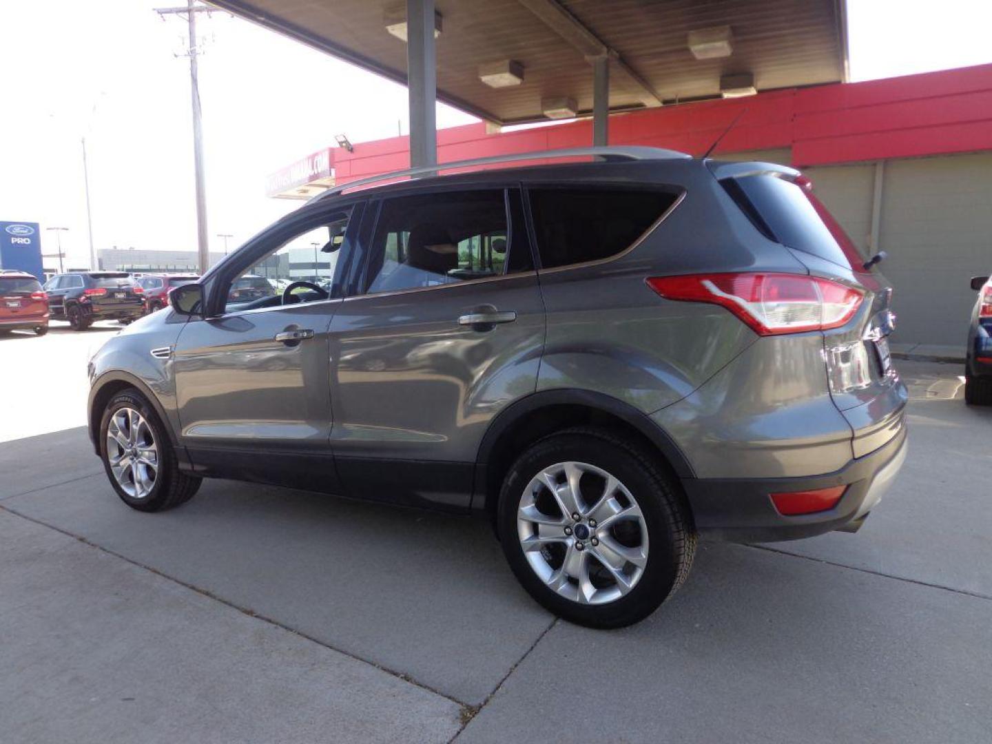 2014 GRAY FORD ESCAPE TITANIUM (1FMCU9J95EU) with an 2.0L engine, Automatic transmission, located at 6610 L St., Omaha, NE, 68117, (402) 731-7800, 41.212872, -96.014702 - 2-OWNER, CLEAN CAREFAX, LOW MILES, PANORAMIC ROOF, NAV, BACKUP CAM, REMOTE START AND NEWER TIRES! *****We have found that most customers do the majority of their shopping online before visiting a dealership. For this reason we feel it necessary to have a competitive price on our used vehicles - Photo#5