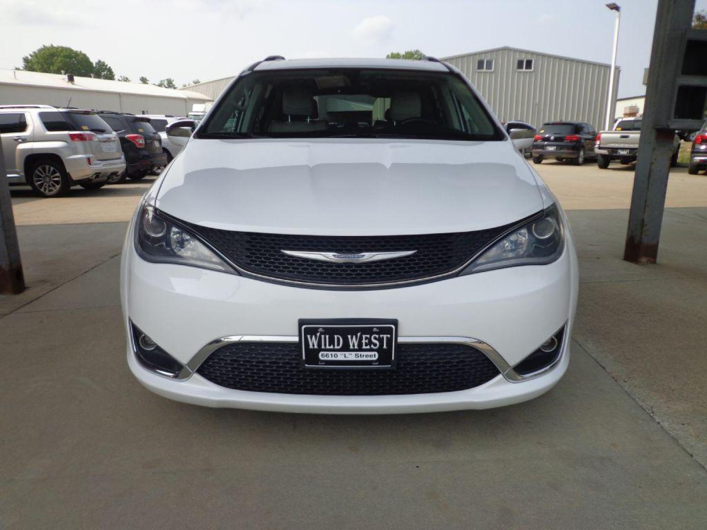 2017 WHITE CHRYSLER PACIFICA LIMITED (2C4RC1GG4HR) with an 3.6L engine, Automatic transmission, located at 6610 L St., Omaha, NE, 68117, (402) 731-7800, 41.212872, -96.014702 - 1-OWNER, CLEAN CARFAX, LOW MILEAGE, PANORAMIC ROOF, REAR ENTERTAINMENT, PREMIUM AUDIO, BLIND SPOT, PARK SENCE, COOLED FRONT SEATS, NEWER TIRES AND MUCH MORE! *****We have found that most customers do the majority of their shopping online before visiting a dealership. For this reason we feel it - Photo#1