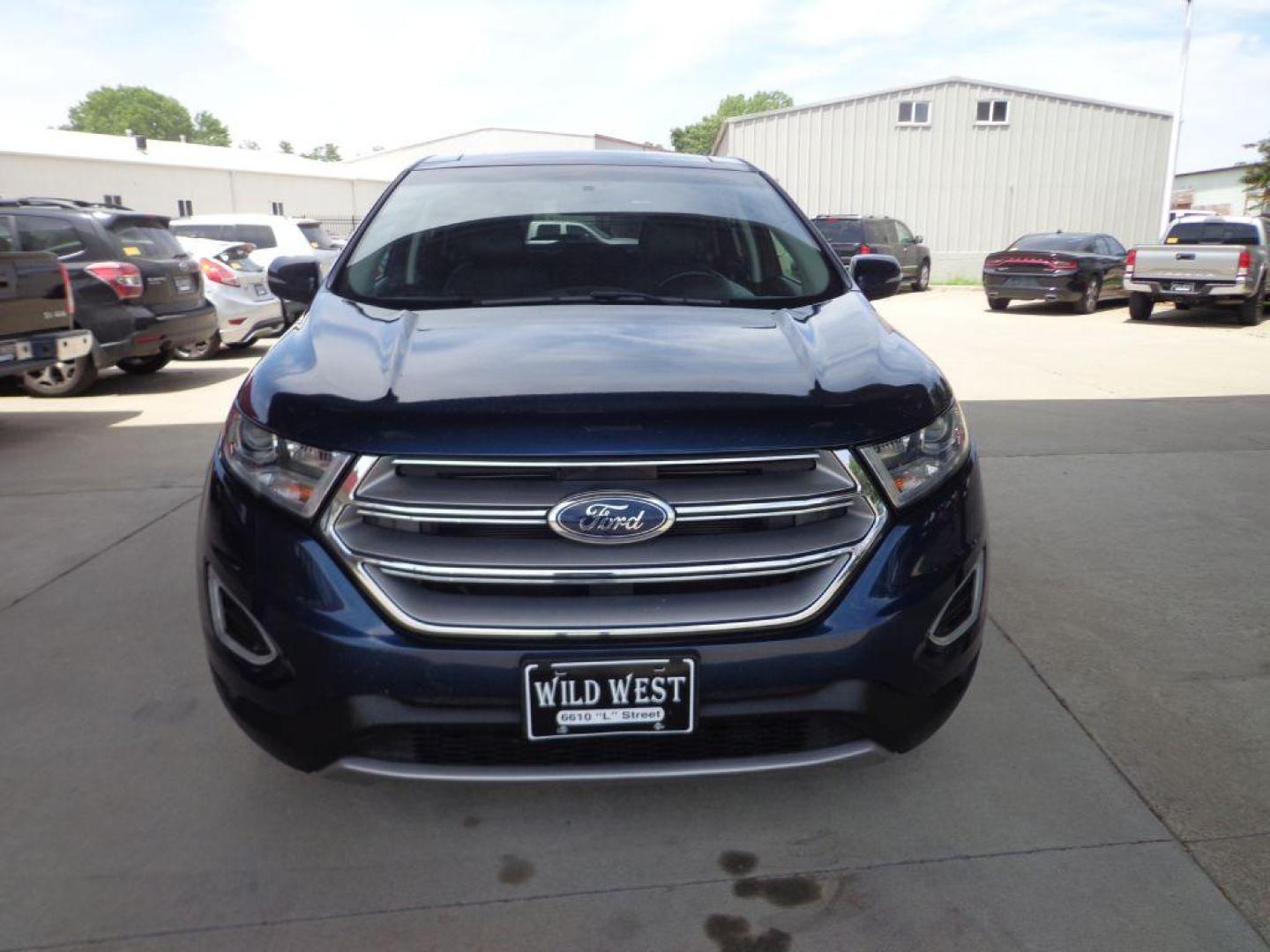 2017 BLUE FORD EDGE TITANIUM (2FMPK4K9XHB) with an 2.0L engine, Automatic transmission, located at 6610 L St., Omaha, NE, 68117, (402) 731-7800, 41.212872, -96.014702 - SHARP TITANIUM MODEL WITH A CLEAN CARFAX, LOW MILEAGE, PANORAMIC ROOF, HEATED/COOLED SEATS, HEATED STEERING WHEEL, NAV, BACKUP CAM, ADAPTIVE CRUISE, BLIND SPOT ASSIST AND A NICE SET OF MICHELINS. *****We have found that most customers do the majority of their shopping online before visiting a - Photo#1