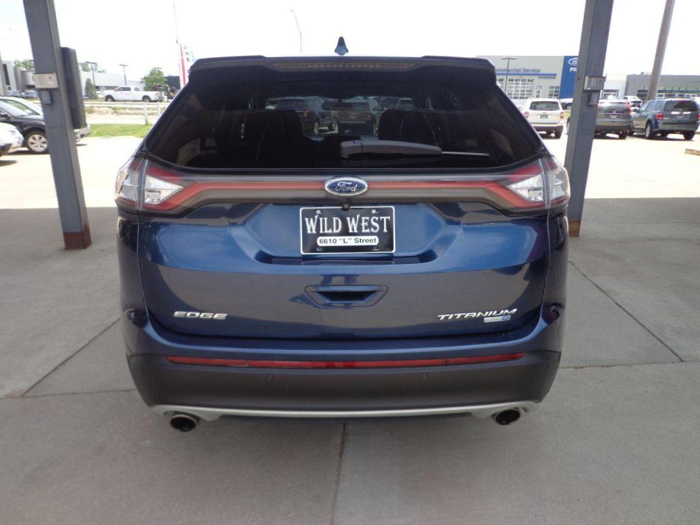 2017 BLUE FORD EDGE TITANIUM (2FMPK4K9XHB) with an 2.0L engine, Automatic transmission, located at 6610 L St., Omaha, NE, 68117, (402) 731-7800, 41.212872, -96.014702 - SHARP TITANIUM MODEL WITH A CLEAN CARFAX, LOW MILEAGE, PANORAMIC ROOF, HEATED/COOLED SEATS, HEATED STEERING WHEEL, NAV, BACKUP CAM, ADAPTIVE CRUISE, BLIND SPOT ASSIST AND A NICE SET OF MICHELINS. *****We have found that most customers do the majority of their shopping online before visiting a - Photo#4