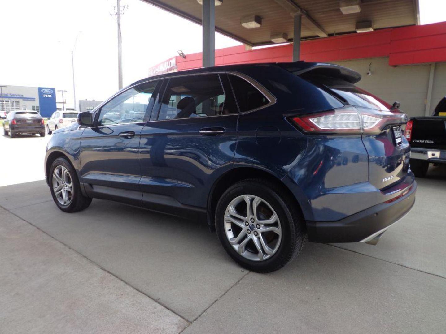 2017 BLUE FORD EDGE TITANIUM (2FMPK4K9XHB) with an 2.0L engine, Automatic transmission, located at 6610 L St., Omaha, NE, 68117, (402) 731-7800, 41.212872, -96.014702 - SHARP TITANIUM MODEL WITH A CLEAN CARFAX, LOW MILEAGE, PANORAMIC ROOF, HEATED/COOLED SEATS, HEATED STEERING WHEEL, NAV, BACKUP CAM, ADAPTIVE CRUISE, BLIND SPOT ASSIST AND A NICE SET OF MICHELINS. *****We have found that most customers do the majority of their shopping online before visiting a - Photo#5
