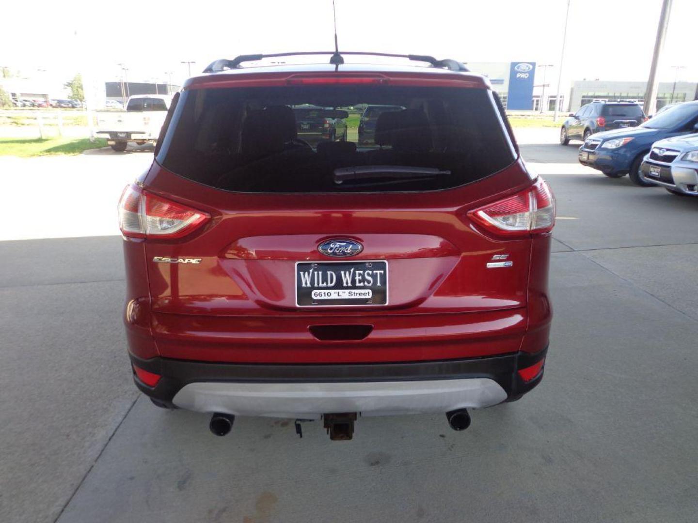 2013 RED FORD ESCAPE SE (1FMCU9G9XDU) with an 2.0L engine, Automatic transmission, located at 6610 L St., Omaha, NE, 68117, (402) 731-7800, 41.212872, -96.014702 - FRESH TRADE-IN WITH A CLEAN CARFAX, PRE-INSPECTED READY TO GO! *****We have found that most customers do the majority of their shopping online before visiting a dealership. For this reason we feel it necessary to have a competitive price on our used vehicles right up front. We spend time resear - Photo#4