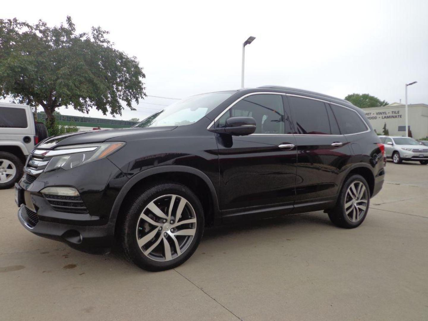 2016 BLACK HONDA PILOT ELITE (5FNYF6H03GB) with an 3.5L engine, Automatic transmission, located at 6610 L St., Omaha, NE, 68117, (402) 731-7800, 41.212872, -96.014702 - SHARP 2-OWNER, CLEAN CARFAX, ELITE MODEL LOADED WITH OPTONS AND NEWER TIRES! *****We have found that most customers do the majority of their shopping online before visiting a dealership. For this reason we feel it necessary to have a competitive price on our used vehicles right up front. We s - Photo#0