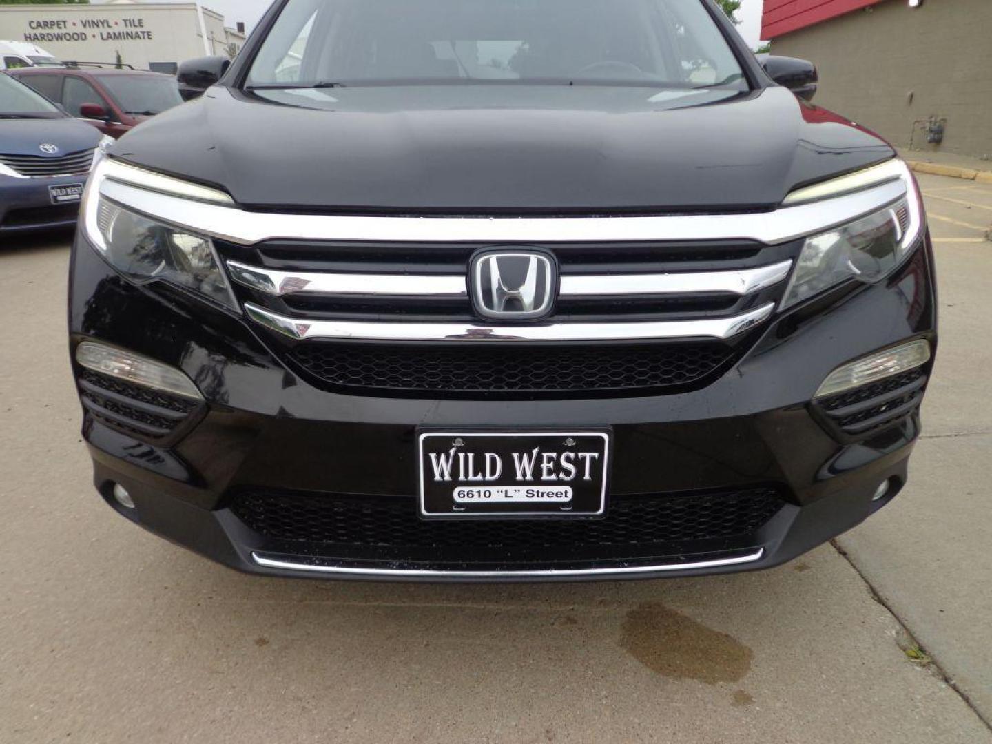 2016 BLACK HONDA PILOT ELITE (5FNYF6H03GB) with an 3.5L engine, Automatic transmission, located at 6610 L St., Omaha, NE, 68117, (402) 731-7800, 41.212872, -96.014702 - SHARP 2-OWNER, CLEAN CARFAX, ELITE MODEL LOADED WITH OPTONS AND NEWER TIRES! *****We have found that most customers do the majority of their shopping online before visiting a dealership. For this reason we feel it necessary to have a competitive price on our used vehicles right up front. We s - Photo#1