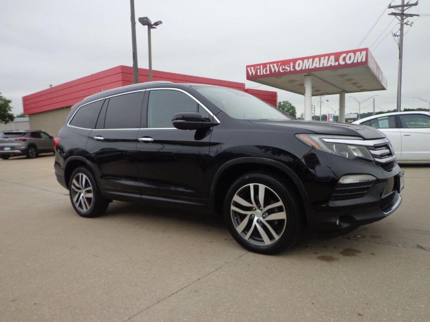 2016 BLACK HONDA PILOT ELITE (5FNYF6H03GB) with an 3.5L engine, Automatic transmission, located at 6610 L St., Omaha, NE, 68117, (402) 731-7800, 41.212872, -96.014702 - SHARP 2-OWNER, CLEAN CARFAX, ELITE MODEL LOADED WITH OPTONS AND NEWER TIRES! *****We have found that most customers do the majority of their shopping online before visiting a dealership. For this reason we feel it necessary to have a competitive price on our used vehicles right up front. We s - Photo#2