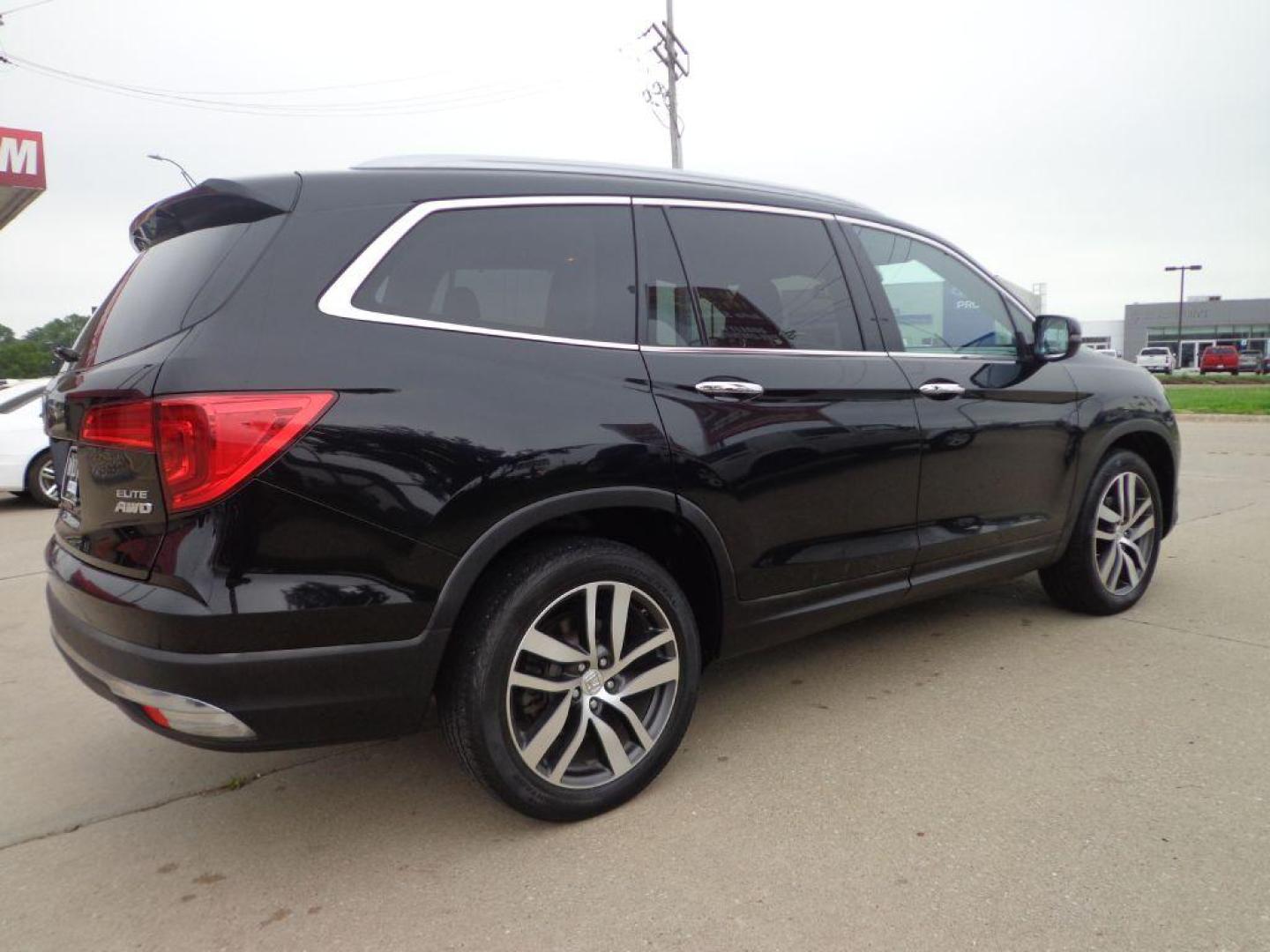 2016 BLACK HONDA PILOT ELITE (5FNYF6H03GB) with an 3.5L engine, Automatic transmission, located at 6610 L St., Omaha, NE, 68117, (402) 731-7800, 41.212872, -96.014702 - SHARP 2-OWNER, CLEAN CARFAX, ELITE MODEL LOADED WITH OPTONS AND NEWER TIRES! *****We have found that most customers do the majority of their shopping online before visiting a dealership. For this reason we feel it necessary to have a competitive price on our used vehicles right up front. We s - Photo#3