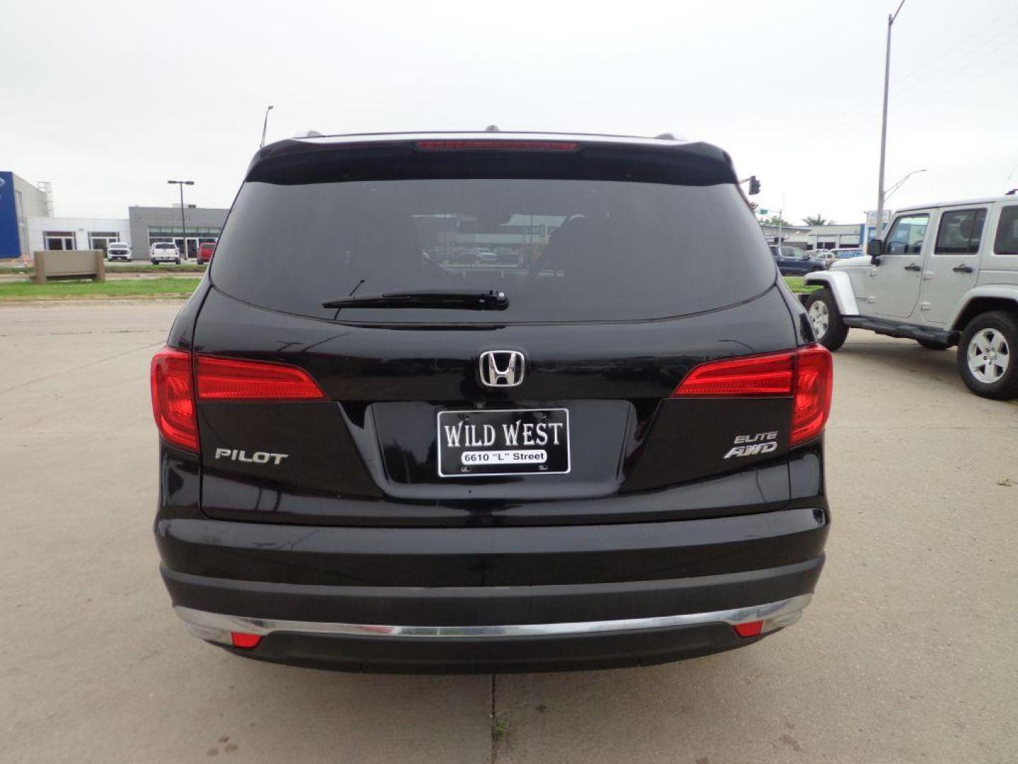2016 BLACK HONDA PILOT ELITE (5FNYF6H03GB) with an 3.5L engine, Automatic transmission, located at 6610 L St., Omaha, NE, 68117, (402) 731-7800, 41.212872, -96.014702 - SHARP 2-OWNER, CLEAN CARFAX, ELITE MODEL LOADED WITH OPTONS AND NEWER TIRES! *****We have found that most customers do the majority of their shopping online before visiting a dealership. For this reason we feel it necessary to have a competitive price on our used vehicles right up front. We s - Photo#4