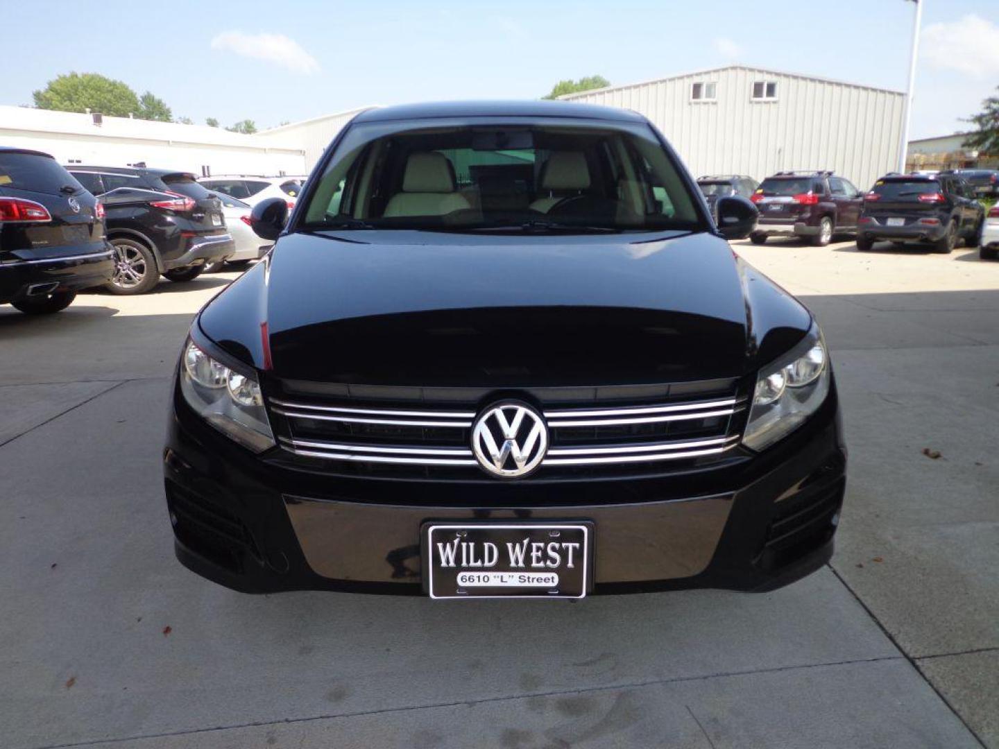 2014 BLACK VOLKSWAGEN TIGUAN S (WVGAV3AX0EW) with an 2.0L engine, Automatic transmission, located at 6610 L St., Omaha, NE, 68117, (402) 731-7800, 41.212872, -96.014702 - SHARP 2-OWNER, CLEAN CARFAX, HEATED LEATHER AND NEWER TIRES! *****We have found that most customers do the majority of their shopping online before visiting a dealership. For this reason we feel it necessary to have a competitive price on our used vehicles right up front. We spend time research - Photo#1