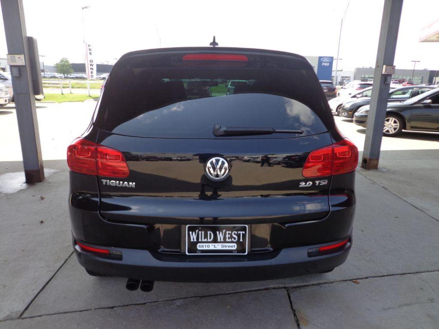 2014 BLACK VOLKSWAGEN TIGUAN S (WVGAV3AX0EW) with an 2.0L engine, Automatic transmission, located at 6610 L St., Omaha, NE, 68117, (402) 731-7800, 41.212872, -96.014702 - SHARP 2-OWNER, CLEAN CARFAX, HEATED LEATHER AND NEWER TIRES! *****We have found that most customers do the majority of their shopping online before visiting a dealership. For this reason we feel it necessary to have a competitive price on our used vehicles right up front. We spend time research - Photo#4