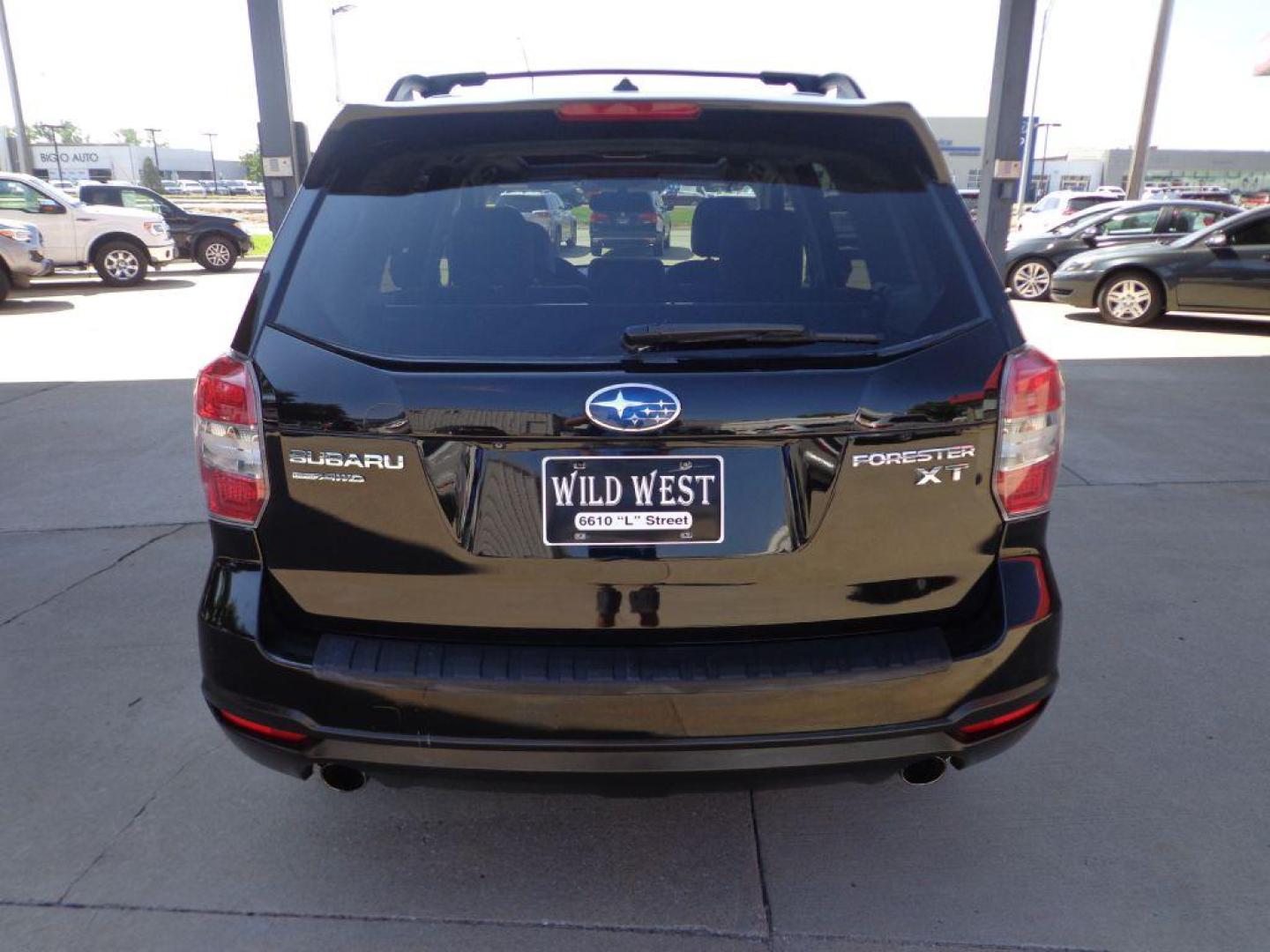 2015 BLACK SUBARU FORESTER 2.0XT TOURING (JF2SJGUC7FH) with an 2.0L engine, Continuously Variable transmission, located at 6610 L St., Omaha, NE, 68117, (402) 731-7800, 41.212872, -96.014702 - THIS VEHICLE HAS A CLEAN TITLE WITH A FREE CARFAX PROVIDED! 1-OWNER, CLEAN CARFAX, LOW MILEAGE. PANO ROOF, HARMON KARDON AUDIO, BACKUP CAM AND NEWER TIRES! *****We have found that most customers do the majority of their shopping online before visiting a dealership. For this reason we feel it - Photo#4
