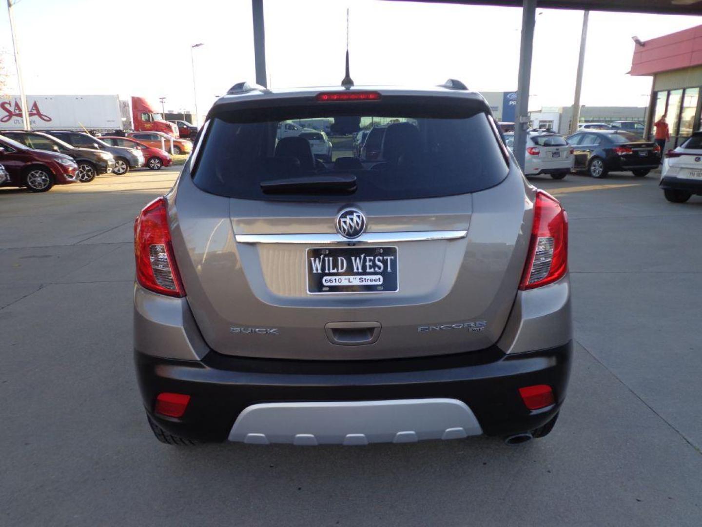 2014 BROWN BUICK ENCORE LEATHER (KL4CJGSB3EB) with an 1.4L engine, Automatic transmission, located at 6610 L St., Omaha, NE, 68117, (402) 731-7800, 41.212872, -96.014702 - THIS VEHICLE HAS A CLEAN TITLE WITH A FREE CARFAX PROVIDED! SHARP ENCORE LEATHER, AWD, A CLEAN CARFAX, LOW MILEAGE, SUNROOF, NAV, BACKUP CAM AND MUCH MORE! *****We have found that most customers do the majority of their shopping online before visiting a dealership. For this reason we feel it nec - Photo#4