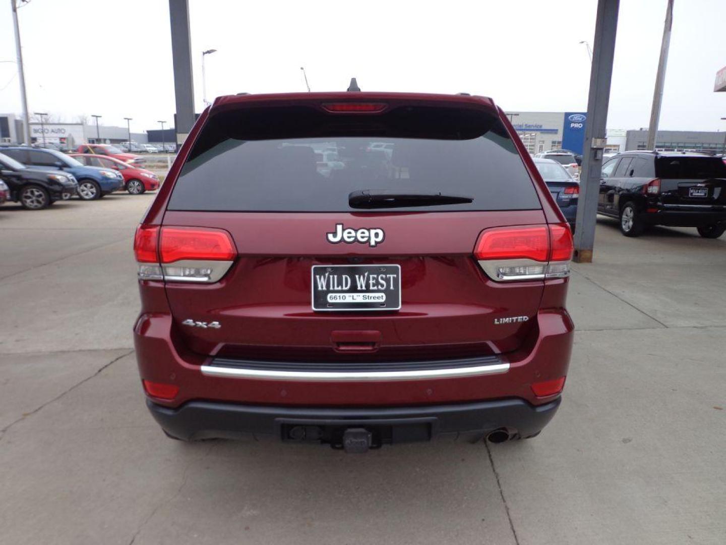 2017 MAROON JEEP GRAND CHEROKEE LIMITED (1C4RJFBGXHC) with an 3.6L engine, Automatic transmission, located at 6610 L St., Omaha, NE, 68117, (402) 731-7800, 41.212872, -96.014702 - THIS VEHICLE HAS A CLEAN TITLE WITH A FREE CARFAX PROVIDED! SHARP LIMITED PACKAGE WITH A CLEAN CARFAX, LOW MILEAGE, SUNROOF, NAV, BLIND SPOT ASSIST, HEATED SEATS/WHEEL AND A NICE SET OF MICHELINS! *****We have found that most customers do the majority of their shopping online before visiting a d - Photo#4
