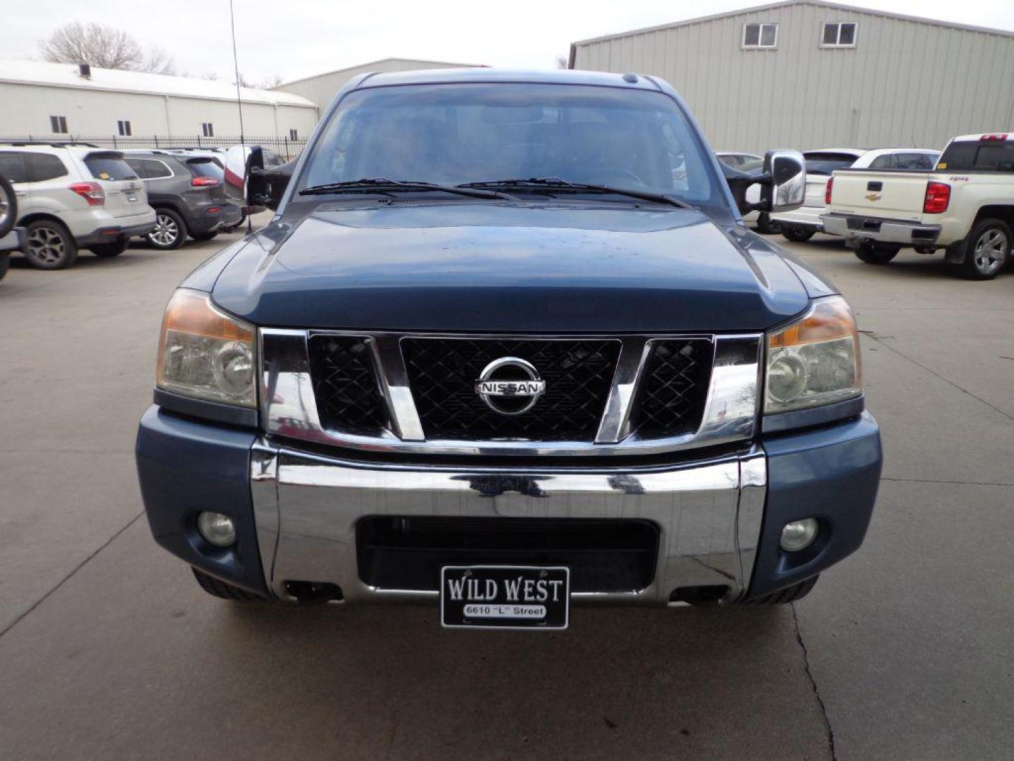 2011 BLUE NISSAN TITAN SL (1N6AA0EC3BN) with an 5.6L engine, Automatic transmission, located at 6610 L St., Omaha, NE, 68117, (402) 731-7800, 41.212872, -96.014702 - THIS VEHICLE HAS A CLEAN TITLE WITH A FREE CARFAX PROVIDED! 2-OWNER, CLEAN CARFAX, LOW MILEAGE, RUST-FREE, HEATED LEATHER, PREMIUM AUDIO AND NEWER TIRES! *****We have found that most customers do the majority of their shopping online before visiting a dealership. For this reason we feel it nec - Photo#1