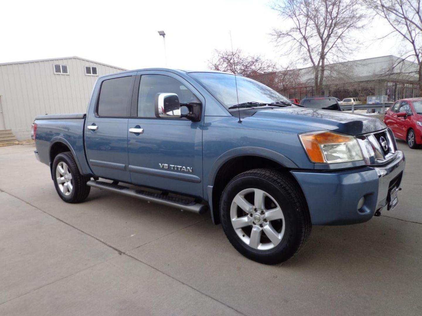 2011 BLUE NISSAN TITAN SL (1N6AA0EC3BN) with an 5.6L engine, Automatic transmission, located at 6610 L St., Omaha, NE, 68117, (402) 731-7800, 41.212872, -96.014702 - THIS VEHICLE HAS A CLEAN TITLE WITH A FREE CARFAX PROVIDED! 2-OWNER, CLEAN CARFAX, LOW MILEAGE, RUST-FREE, HEATED LEATHER, PREMIUM AUDIO AND NEWER TIRES! *****We have found that most customers do the majority of their shopping online before visiting a dealership. For this reason we feel it nec - Photo#2
