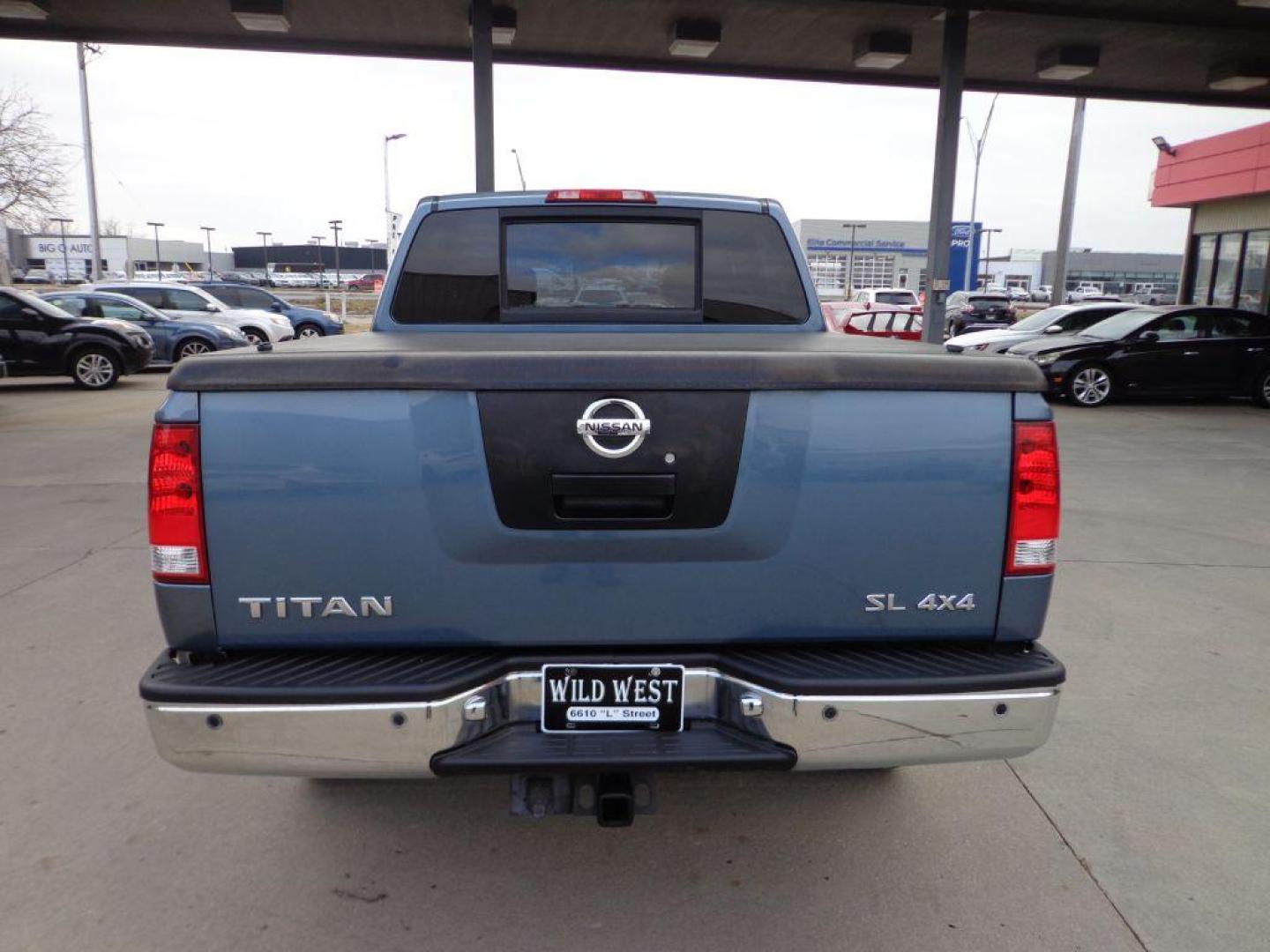 2011 BLUE NISSAN TITAN SL (1N6AA0EC3BN) with an 5.6L engine, Automatic transmission, located at 6610 L St., Omaha, NE, 68117, (402) 731-7800, 41.212872, -96.014702 - THIS VEHICLE HAS A CLEAN TITLE WITH A FREE CARFAX PROVIDED! 2-OWNER, CLEAN CARFAX, LOW MILEAGE, RUST-FREE, HEATED LEATHER, PREMIUM AUDIO AND NEWER TIRES! *****We have found that most customers do the majority of their shopping online before visiting a dealership. For this reason we feel it nec - Photo#4