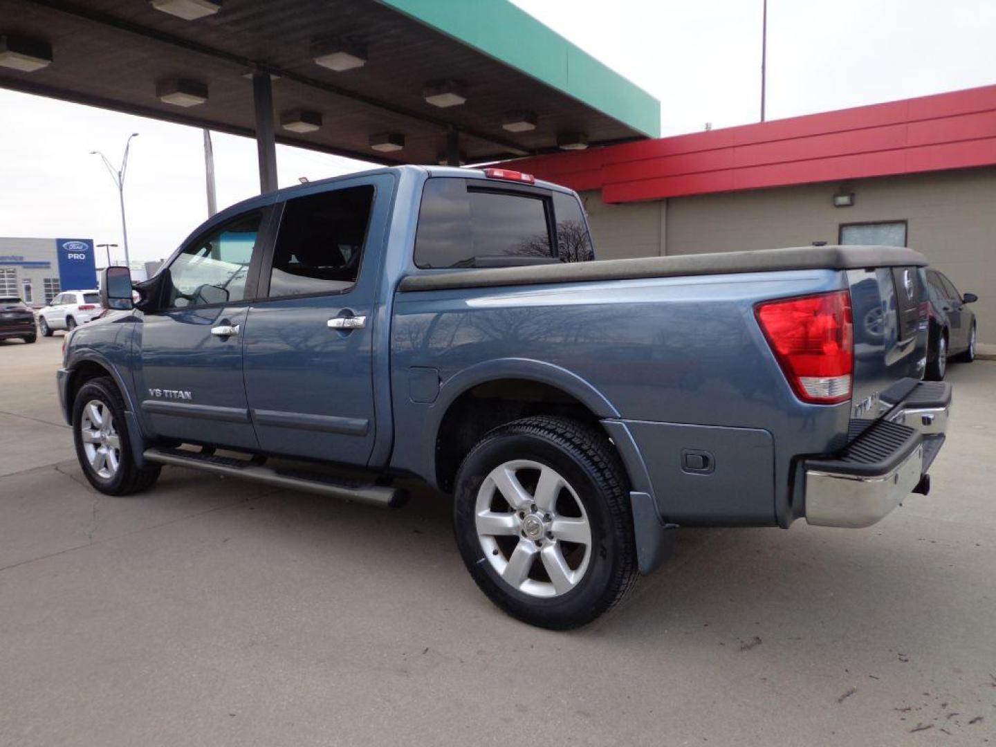 2011 BLUE NISSAN TITAN SL (1N6AA0EC3BN) with an 5.6L engine, Automatic transmission, located at 6610 L St., Omaha, NE, 68117, (402) 731-7800, 41.212872, -96.014702 - THIS VEHICLE HAS A CLEAN TITLE WITH A FREE CARFAX PROVIDED! 2-OWNER, CLEAN CARFAX, LOW MILEAGE, RUST-FREE, HEATED LEATHER, PREMIUM AUDIO AND NEWER TIRES! *****We have found that most customers do the majority of their shopping online before visiting a dealership. For this reason we feel it nec - Photo#5