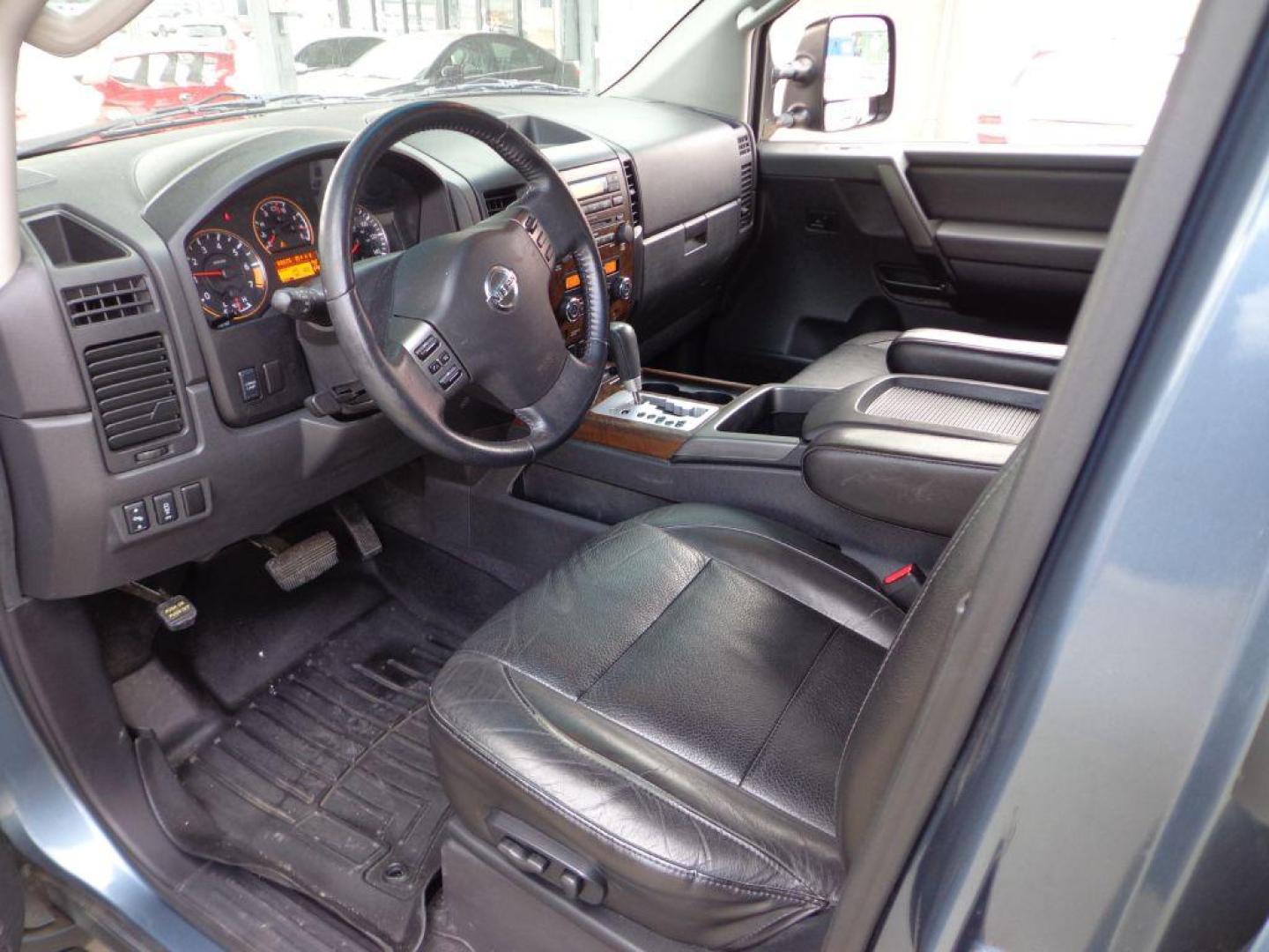 2011 BLUE NISSAN TITAN SL (1N6AA0EC3BN) with an 5.6L engine, Automatic transmission, located at 6610 L St., Omaha, NE, 68117, (402) 731-7800, 41.212872, -96.014702 - THIS VEHICLE HAS A CLEAN TITLE WITH A FREE CARFAX PROVIDED! 2-OWNER, CLEAN CARFAX, LOW MILEAGE, RUST-FREE, HEATED LEATHER, PREMIUM AUDIO AND NEWER TIRES! *****We have found that most customers do the majority of their shopping online before visiting a dealership. For this reason we feel it nec - Photo#14