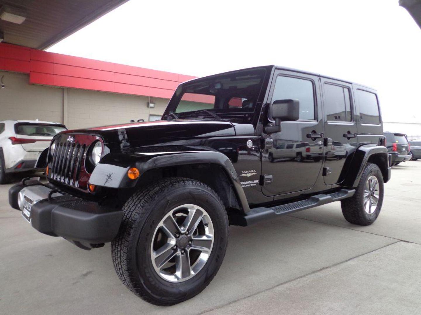 2013 BLACK JEEP WRANGLER UNLIMI SAHARA (1C4HJWEGXDL) with an 3.6L engine, Automatic transmission, located at 6610 L St., Omaha, NE, 68117, (402) 731-7800, 41.212872, -96.014702 - THIS VEHICLE HAS A BEEN FULLY INSPECTED AND HAS A CLEAN TITLE WITH A FREE CARFAX REPORT. SHARP 2-OWNER SAHARA WITH A CLEAN CARFAX, LOW MILEAGE, RUST-FREE UNDERCARRIAGE, HEATED SEATS, NAV, PREMIUM AUDIO AND NEWER TIRES! *****We have found that most customers do the majority of their shopping onl - Photo#0