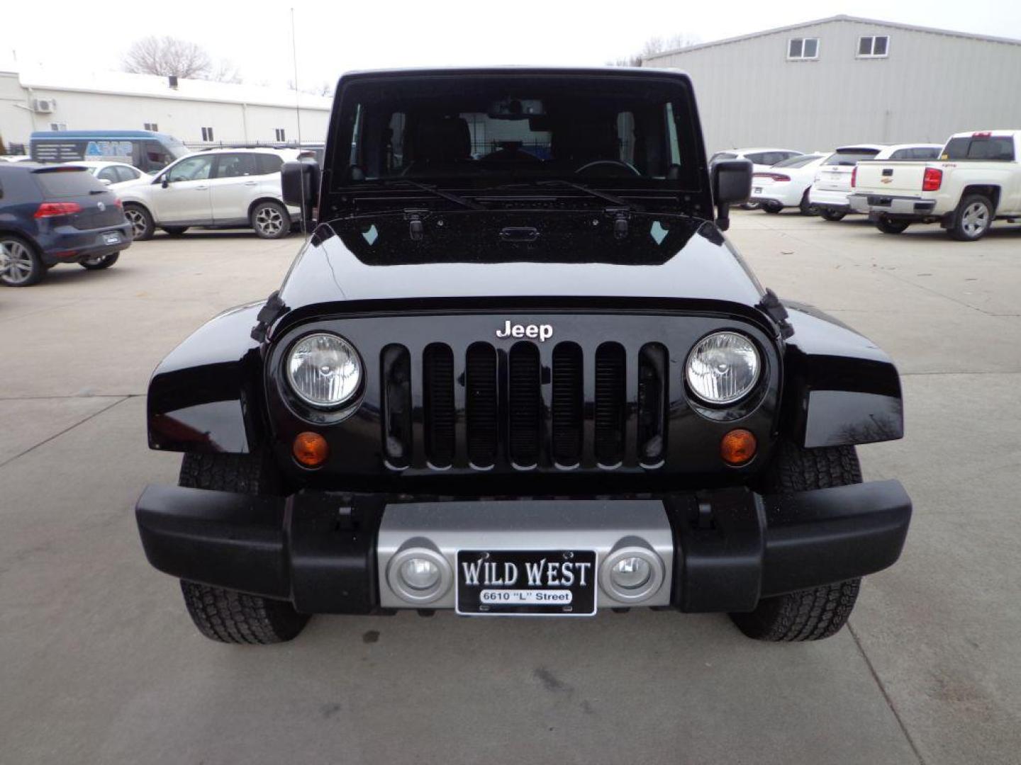 2013 BLACK JEEP WRANGLER UNLIMI SAHARA (1C4HJWEGXDL) with an 3.6L engine, Automatic transmission, located at 6610 L St., Omaha, NE, 68117, (402) 731-7800, 41.212872, -96.014702 - THIS VEHICLE HAS A BEEN FULLY INSPECTED AND HAS A CLEAN TITLE WITH A FREE CARFAX REPORT. SHARP 2-OWNER SAHARA WITH A CLEAN CARFAX, LOW MILEAGE, RUST-FREE UNDERCARRIAGE, HEATED SEATS, NAV, PREMIUM AUDIO AND NEWER TIRES! *****We have found that most customers do the majority of their shopping onl - Photo#1