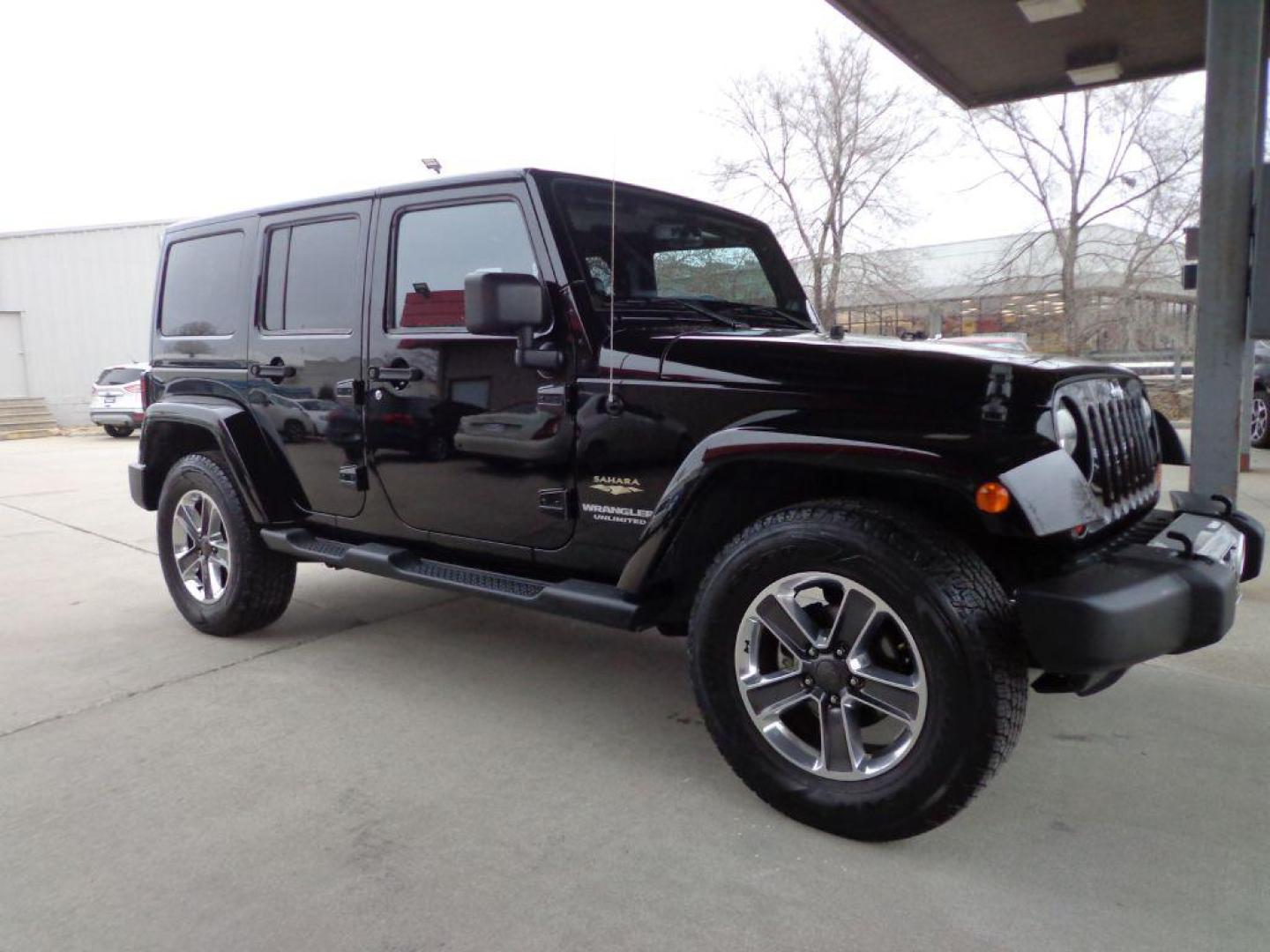 2013 BLACK JEEP WRANGLER UNLIMI SAHARA (1C4HJWEGXDL) with an 3.6L engine, Automatic transmission, located at 6610 L St., Omaha, NE, 68117, (402) 731-7800, 41.212872, -96.014702 - THIS VEHICLE HAS A BEEN FULLY INSPECTED AND HAS A CLEAN TITLE WITH A FREE CARFAX REPORT. SHARP 2-OWNER SAHARA WITH A CLEAN CARFAX, LOW MILEAGE, RUST-FREE UNDERCARRIAGE, HEATED SEATS, NAV, PREMIUM AUDIO AND NEWER TIRES! *****We have found that most customers do the majority of their shopping onl - Photo#2