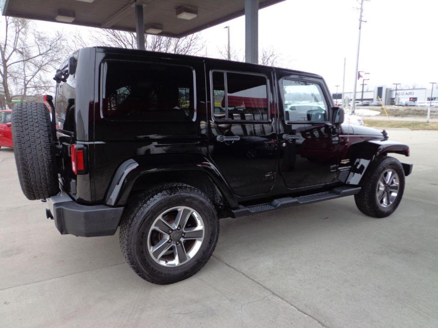 2013 BLACK JEEP WRANGLER UNLIMI SAHARA (1C4HJWEGXDL) with an 3.6L engine, Automatic transmission, located at 6610 L St., Omaha, NE, 68117, (402) 731-7800, 41.212872, -96.014702 - THIS VEHICLE HAS A BEEN FULLY INSPECTED AND HAS A CLEAN TITLE WITH A FREE CARFAX REPORT. SHARP 2-OWNER SAHARA WITH A CLEAN CARFAX, LOW MILEAGE, RUST-FREE UNDERCARRIAGE, HEATED SEATS, NAV, PREMIUM AUDIO AND NEWER TIRES! *****We have found that most customers do the majority of their shopping onl - Photo#3