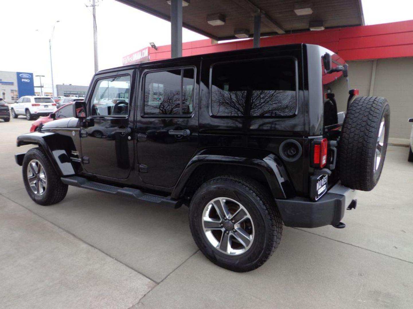 2013 BLACK JEEP WRANGLER UNLIMI SAHARA (1C4HJWEGXDL) with an 3.6L engine, Automatic transmission, located at 6610 L St., Omaha, NE, 68117, (402) 731-7800, 41.212872, -96.014702 - THIS VEHICLE HAS A BEEN FULLY INSPECTED AND HAS A CLEAN TITLE WITH A FREE CARFAX REPORT. SHARP 2-OWNER SAHARA WITH A CLEAN CARFAX, LOW MILEAGE, RUST-FREE UNDERCARRIAGE, HEATED SEATS, NAV, PREMIUM AUDIO AND NEWER TIRES! *****We have found that most customers do the majority of their shopping onl - Photo#5