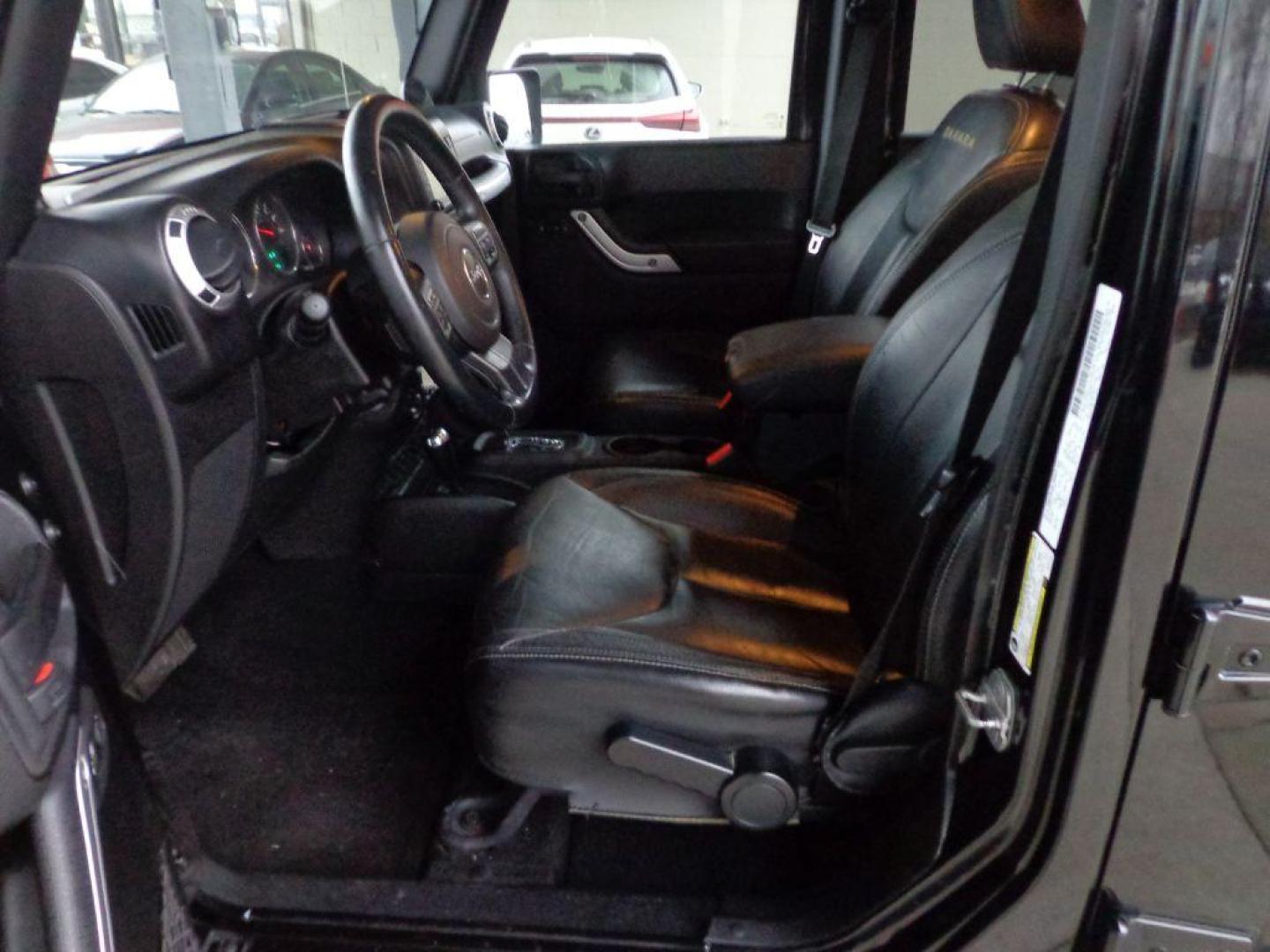 2013 BLACK JEEP WRANGLER UNLIMI SAHARA (1C4HJWEGXDL) with an 3.6L engine, Automatic transmission, located at 6610 L St., Omaha, NE, 68117, (402) 731-7800, 41.212872, -96.014702 - THIS VEHICLE HAS A BEEN FULLY INSPECTED AND HAS A CLEAN TITLE WITH A FREE CARFAX REPORT. SHARP 2-OWNER SAHARA WITH A CLEAN CARFAX, LOW MILEAGE, RUST-FREE UNDERCARRIAGE, HEATED SEATS, NAV, PREMIUM AUDIO AND NEWER TIRES! *****We have found that most customers do the majority of their shopping onl - Photo#12