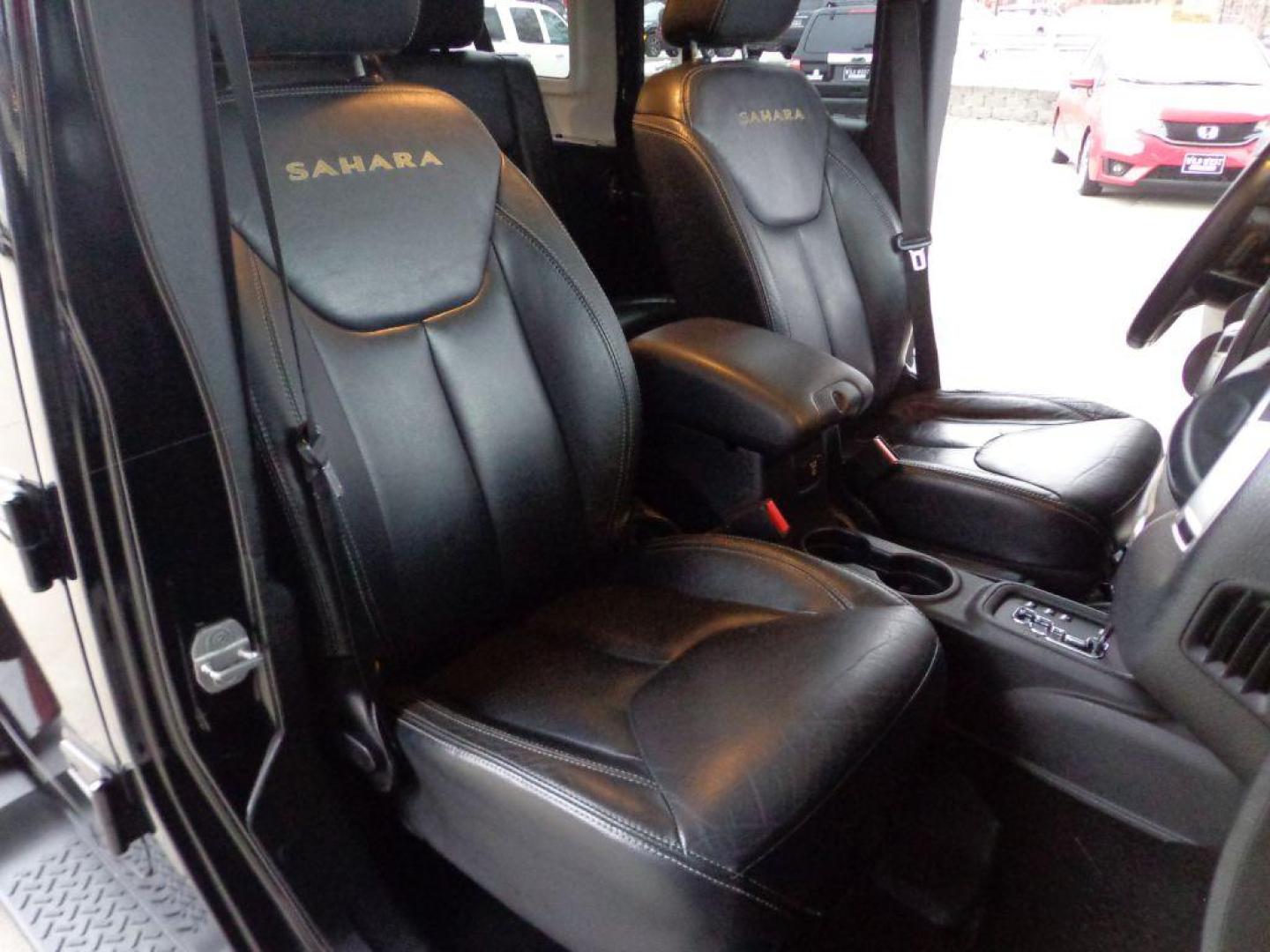 2013 BLACK JEEP WRANGLER UNLIMI SAHARA (1C4HJWEGXDL) with an 3.6L engine, Automatic transmission, located at 6610 L St., Omaha, NE, 68117, (402) 731-7800, 41.212872, -96.014702 - THIS VEHICLE HAS A BEEN FULLY INSPECTED AND HAS A CLEAN TITLE WITH A FREE CARFAX REPORT. SHARP 2-OWNER SAHARA WITH A CLEAN CARFAX, LOW MILEAGE, RUST-FREE UNDERCARRIAGE, HEATED SEATS, NAV, PREMIUM AUDIO AND NEWER TIRES! *****We have found that most customers do the majority of their shopping onl - Photo#16