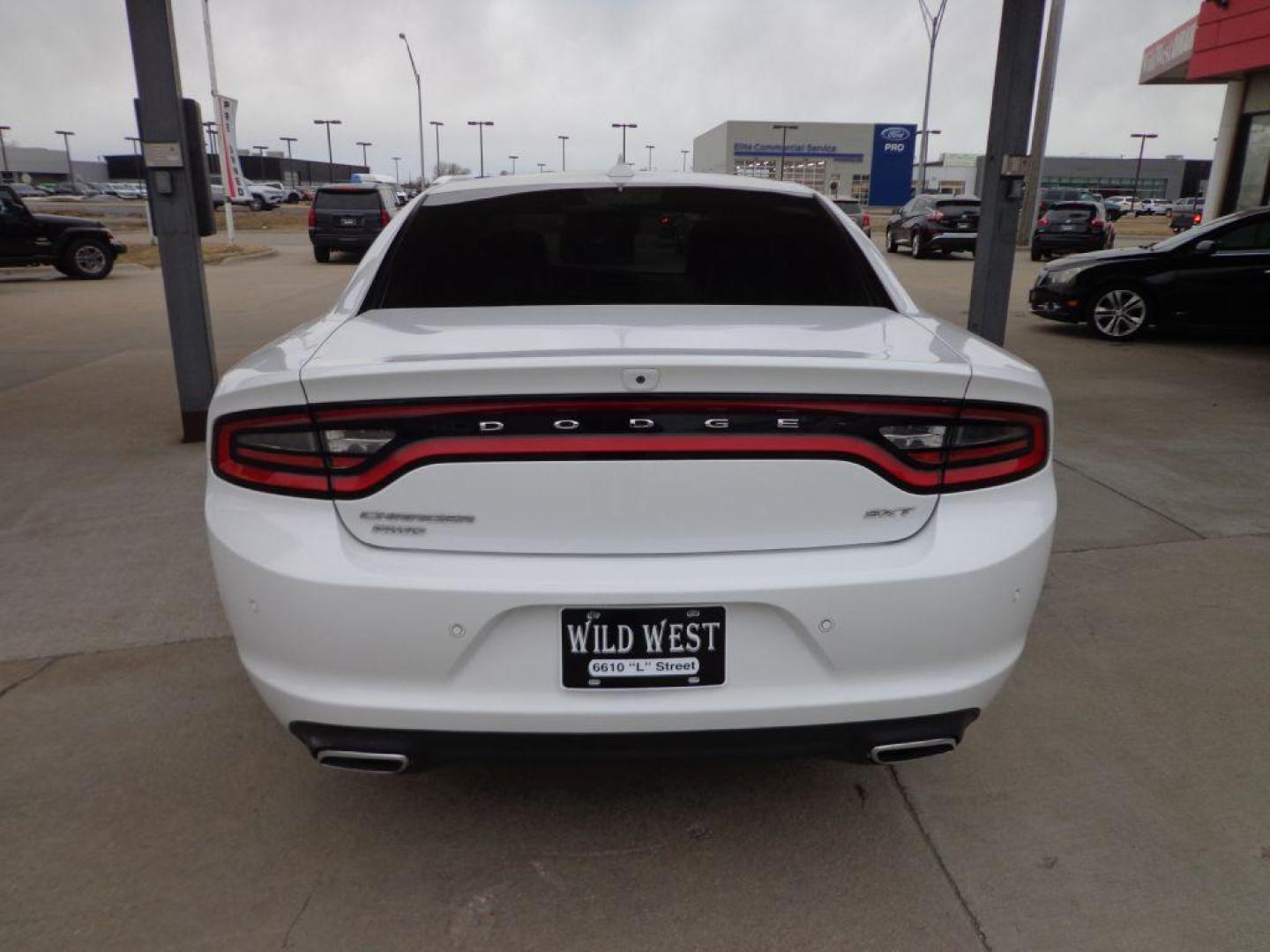 2015 WHITE DODGE CHARGER SXT (2C3CDXJG7FH) with an 3.6L engine, Automatic transmission, located at 6610 L St., Omaha, NE, 68117, (402) 731-7800, 41.212872, -96.014702 - THIS VEHICLE HAS A BEEN FULLY INSPECTED AND HAS A CLEAN TITLE WITH A FREE CARFAX REPORT PROVIDED! 1-OWNER, CLEAN CARFAX, LOW MILEAGE, AWD, HEATED/COOLED SEATS, LANE DEPARTURE, ADAPTIVE CRUISE, PREMIUM AUDIO, NAV, BACKUP CAM AND MUCH MORE *****We have found that most customers do the majority of - Photo#4